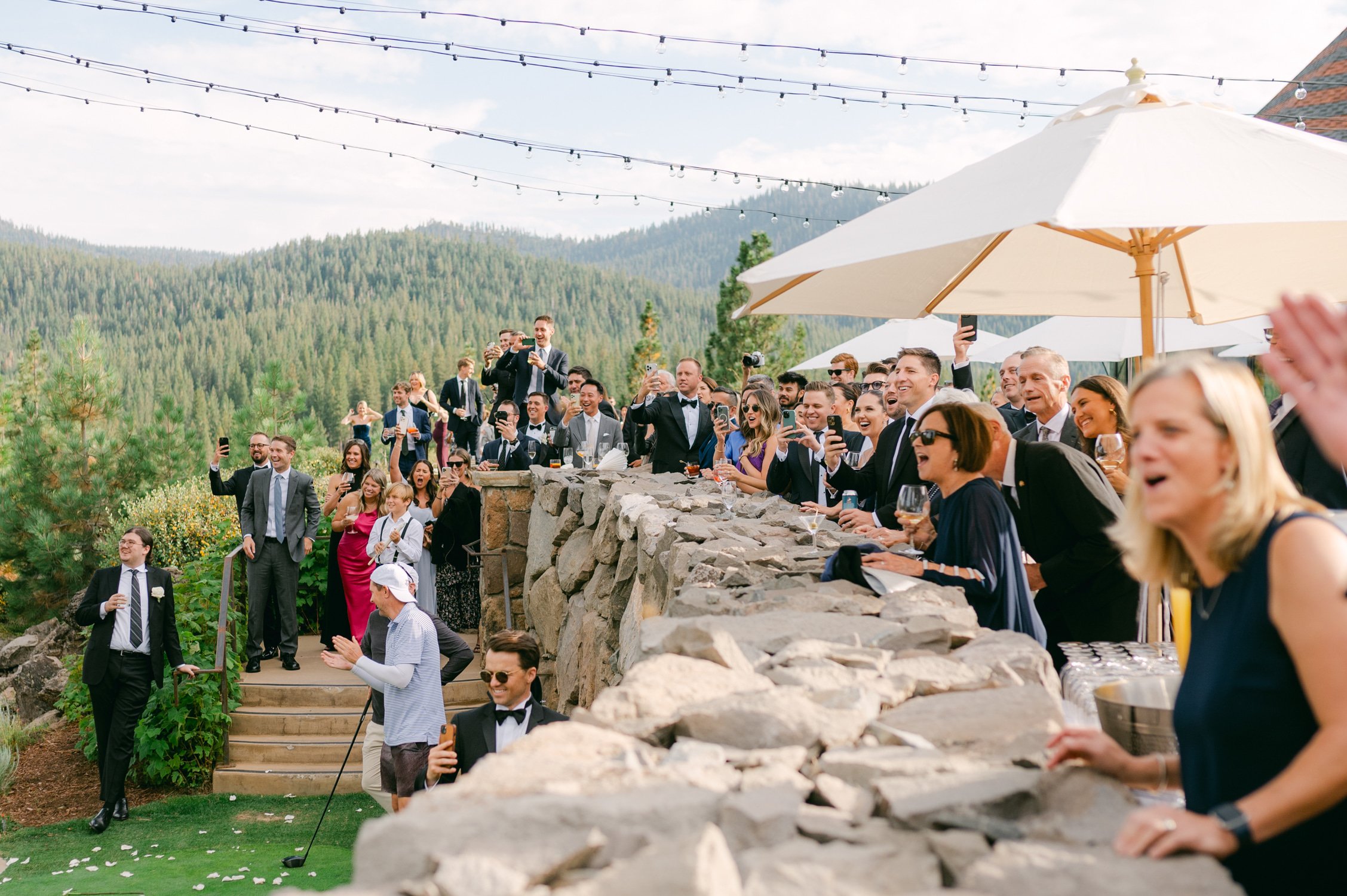 Martis Camp Wedding, photo of the wedding guests cheering the newlywed couple during the afternoon reception
