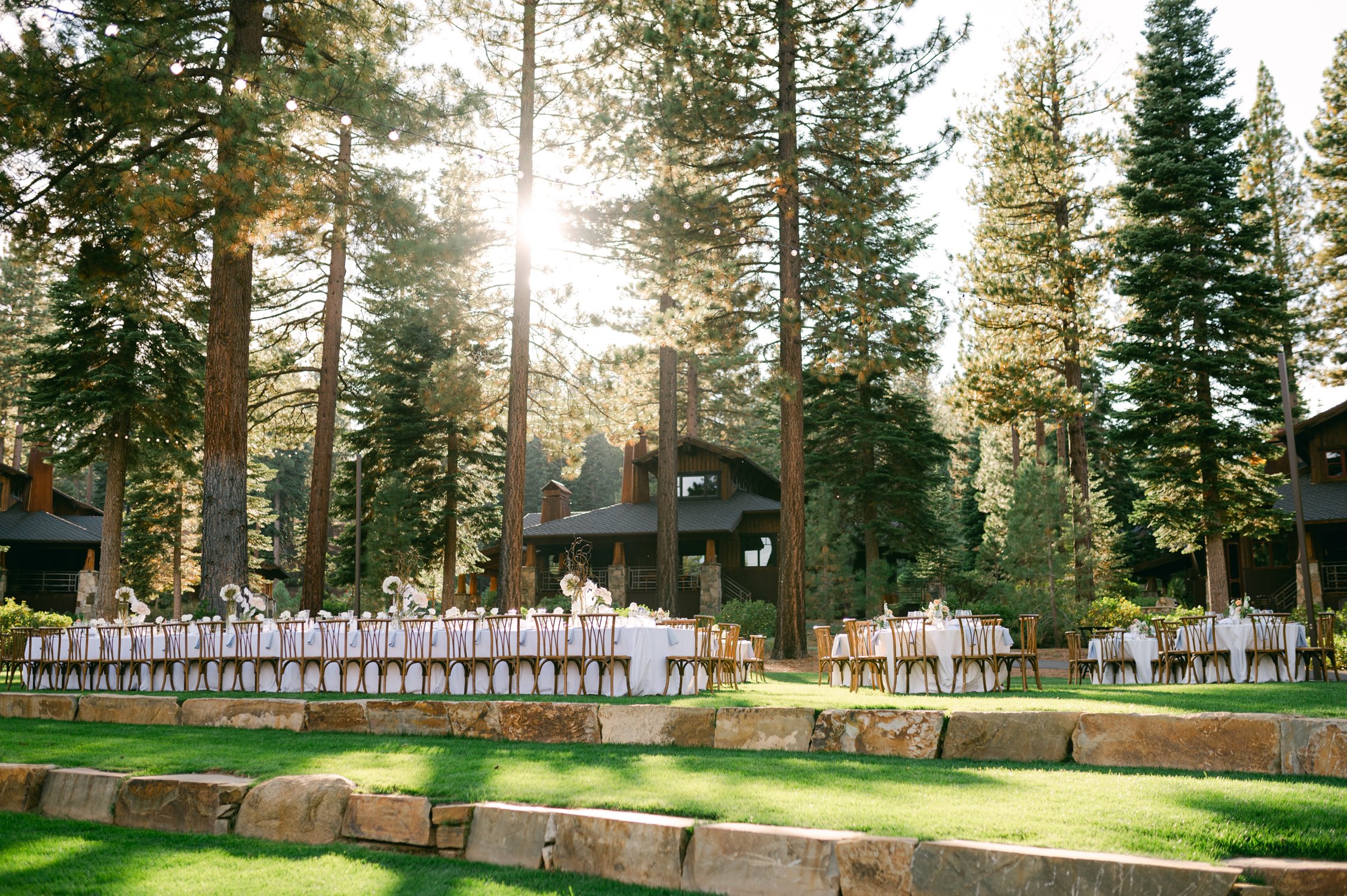 Martis Camp Wedding, photo of the outdoor wedding reception with tall trees surrounding