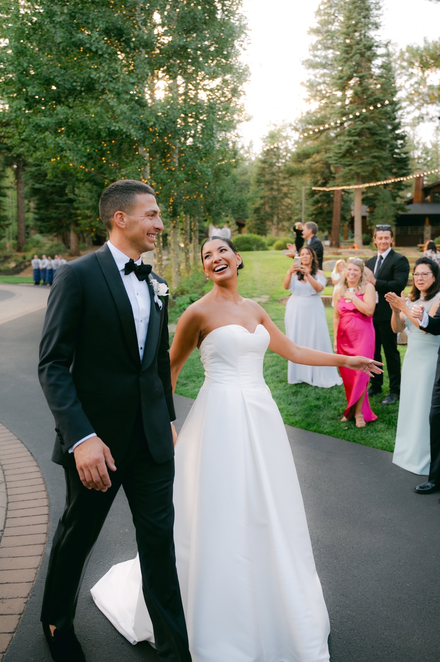 Martis Camp Wedding, photo of the newlywed couple happily walking to their reception