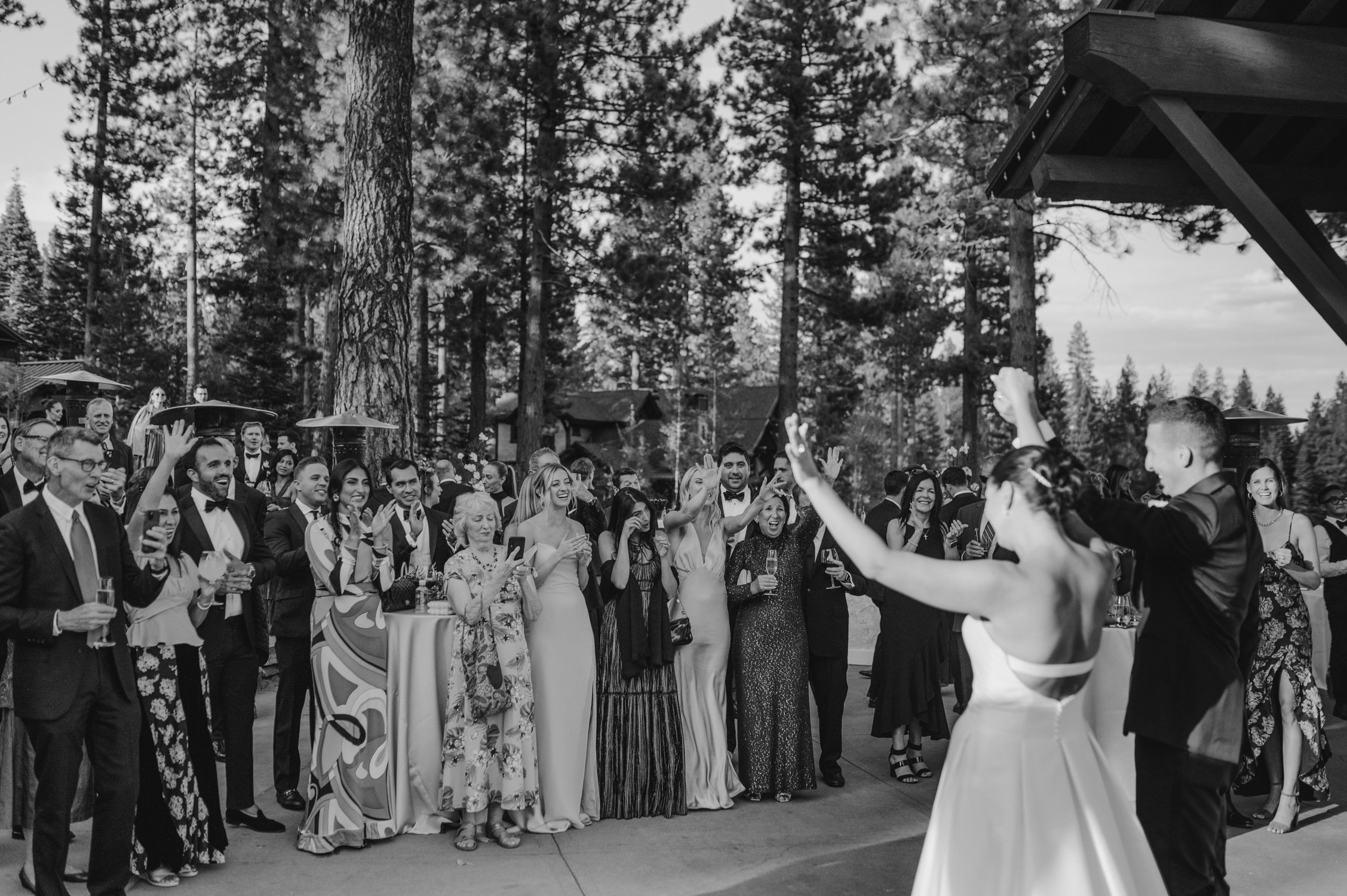Martis Camp Wedding, photo of the newlywed couple waving and greeting their guests
