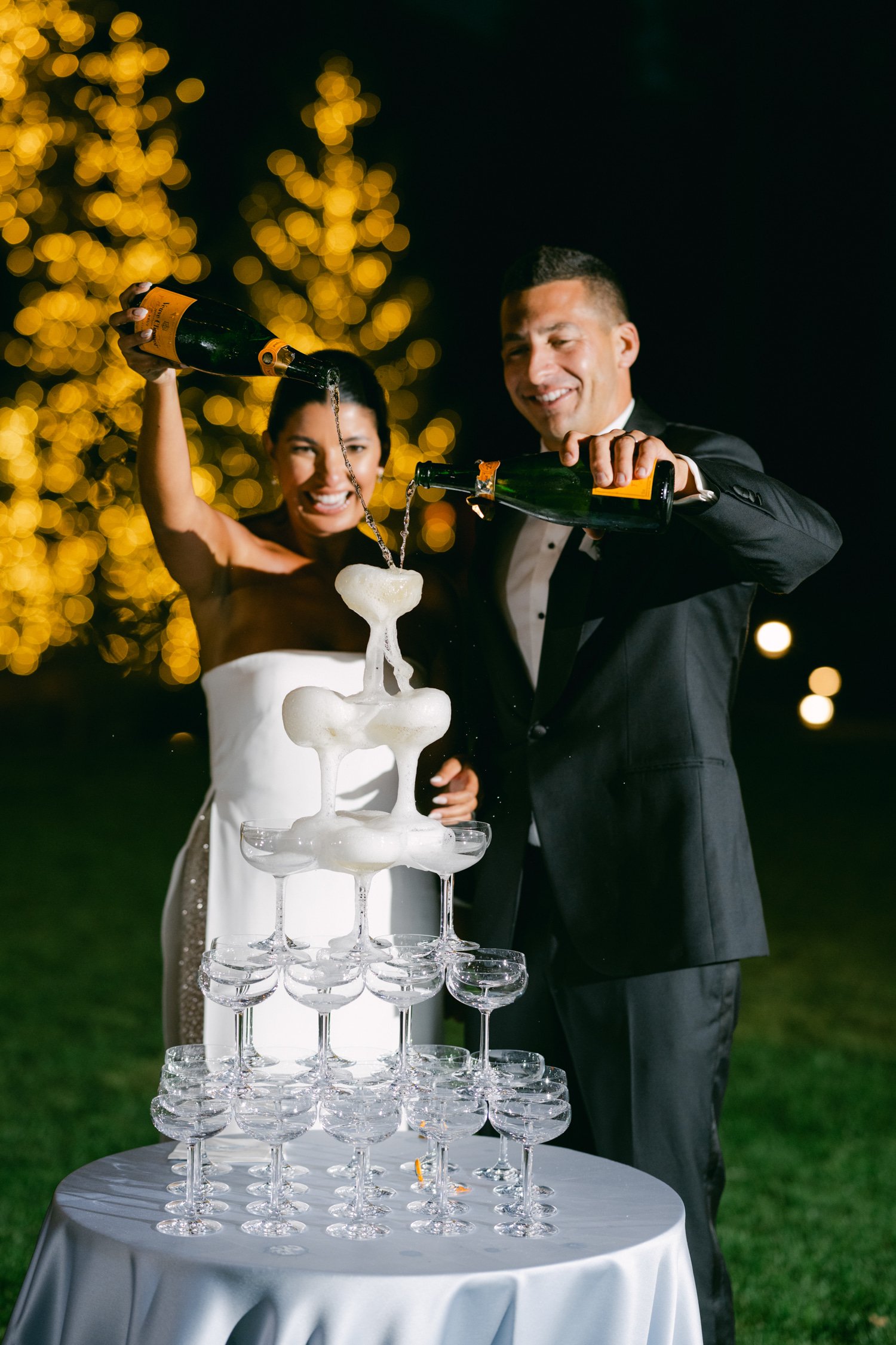 Martis Camp Wedding, photo of the couple poring champagne