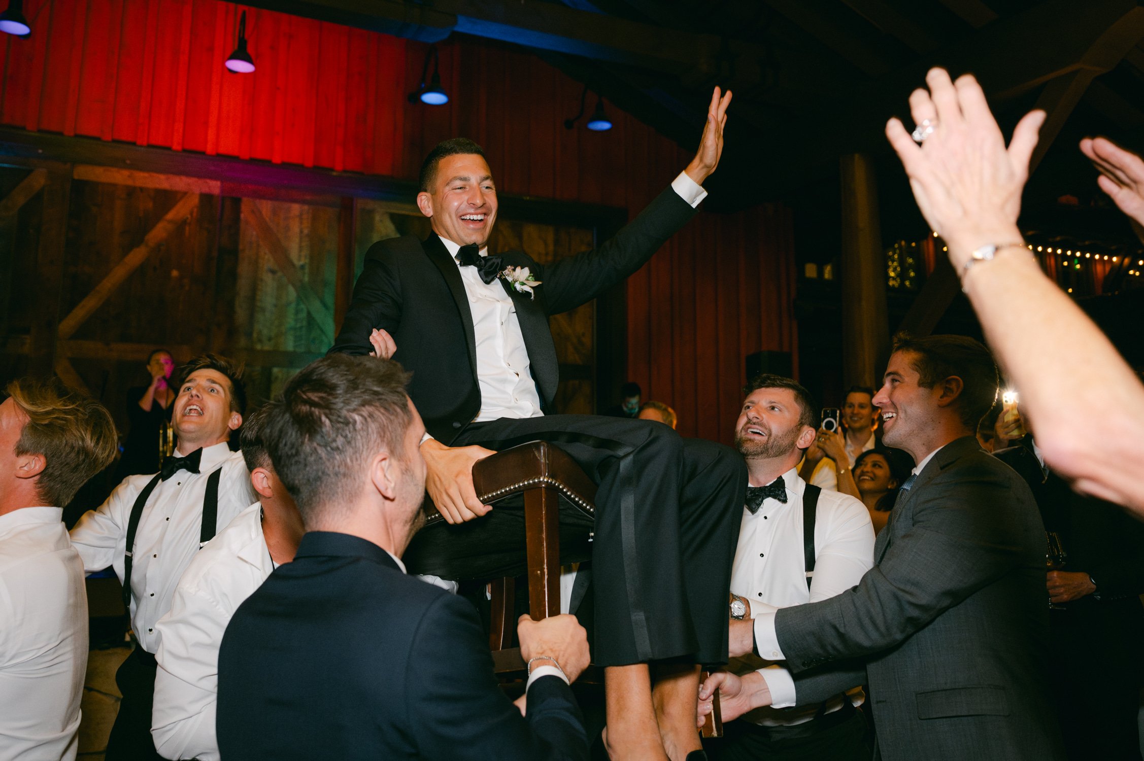 Martis Camp Wedding, photo of the groom being carried during the afterparty
