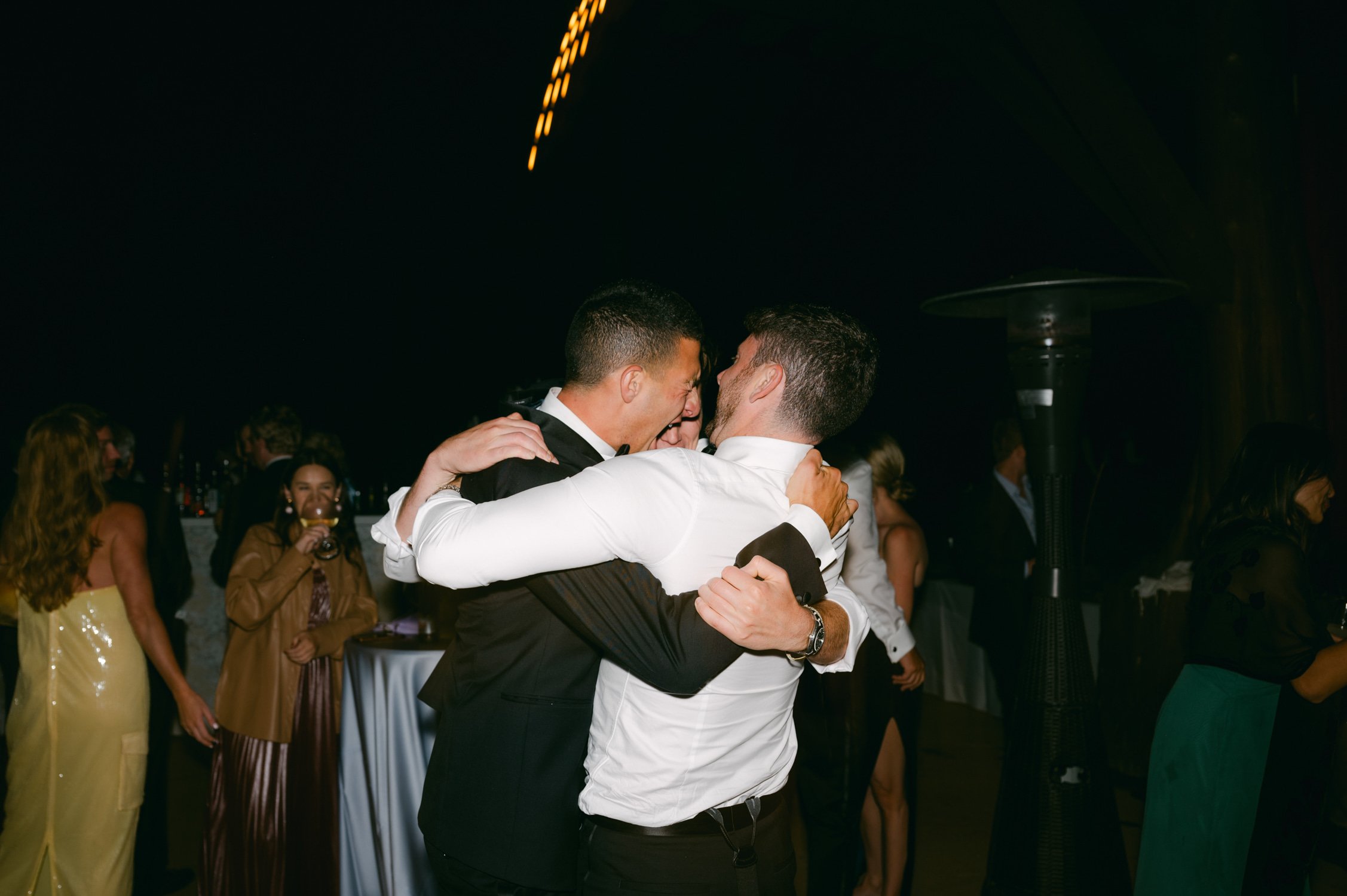 Martis Camp Wedding, photo of the guests hugging during the afterparty