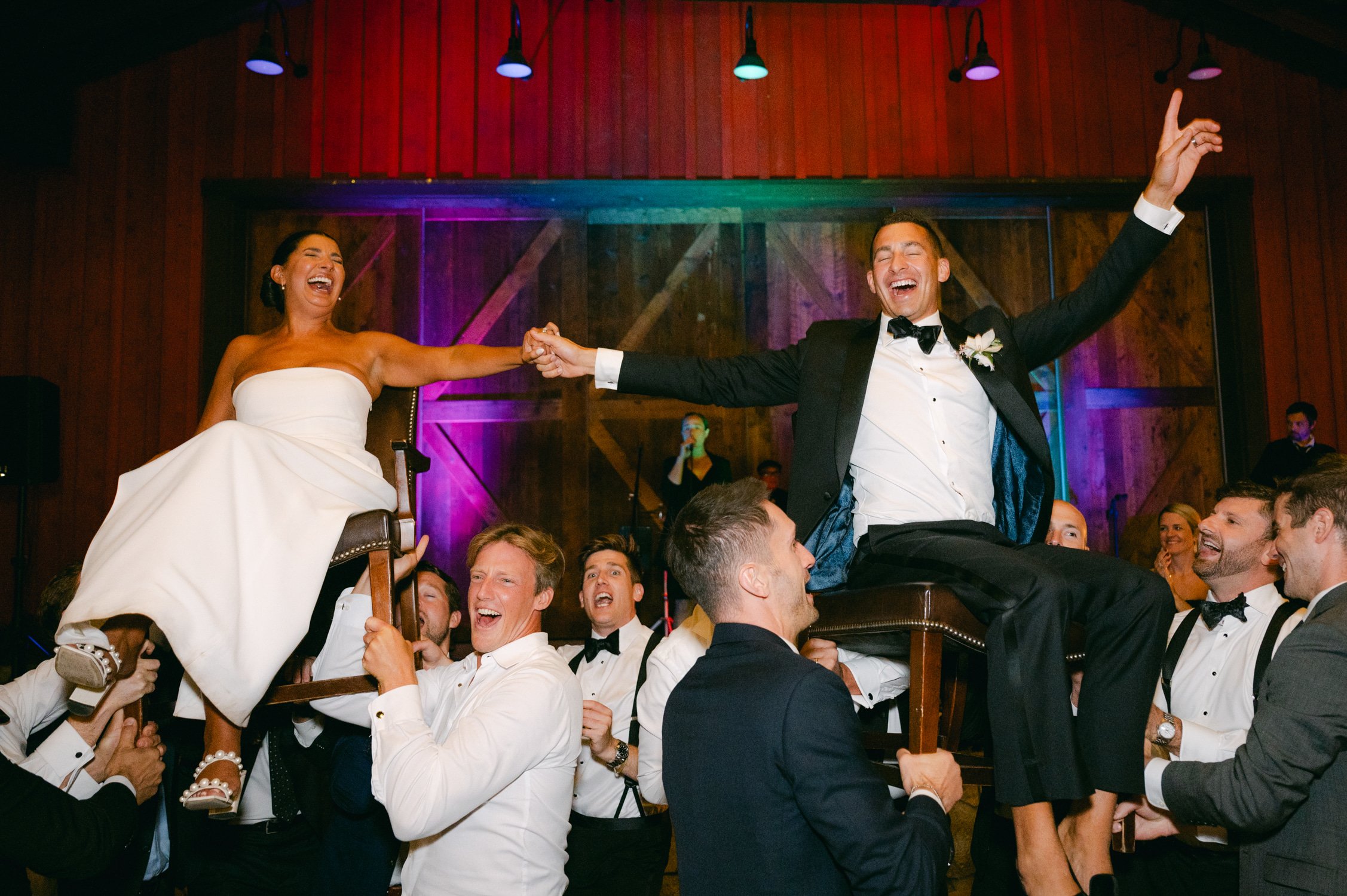 Martis Camp Wedding, photo of the couple being carried during the afterparty