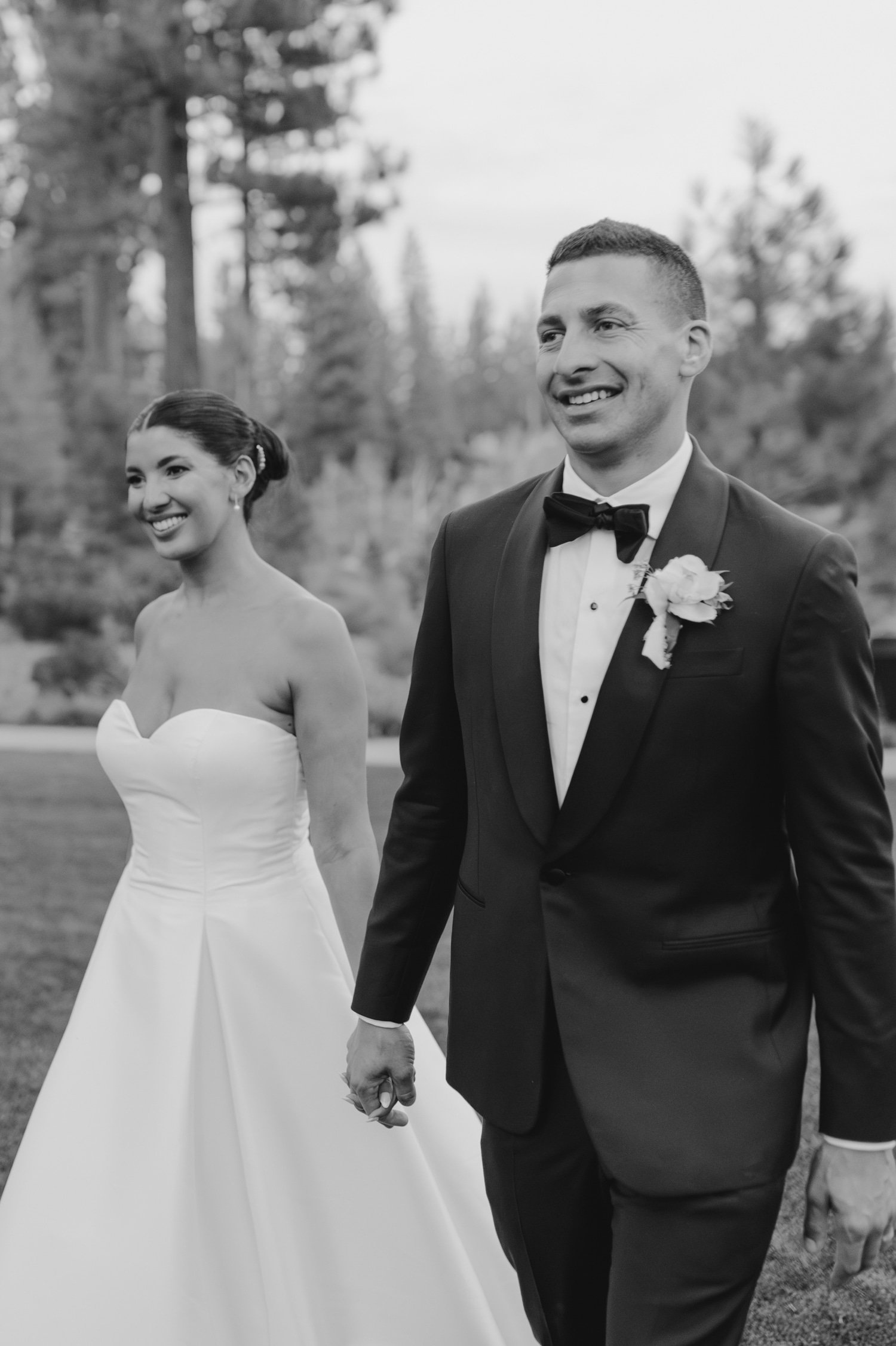 Martis Camp Wedding, photo of the newlywed couple holding hands while walking