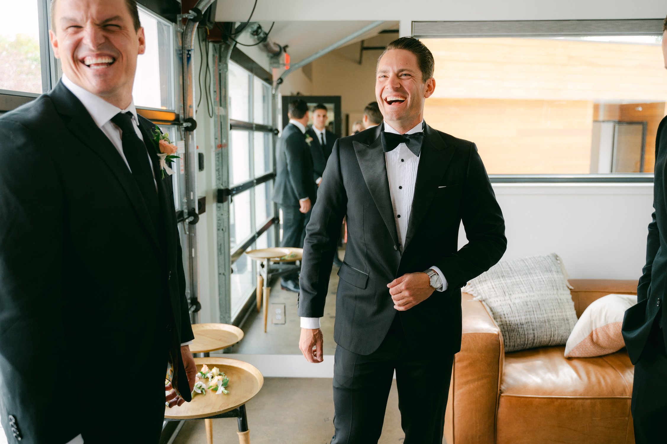 Elm Estate Wedding photos, photo of the groom with his best man in their tailor-made black wedding day suit 