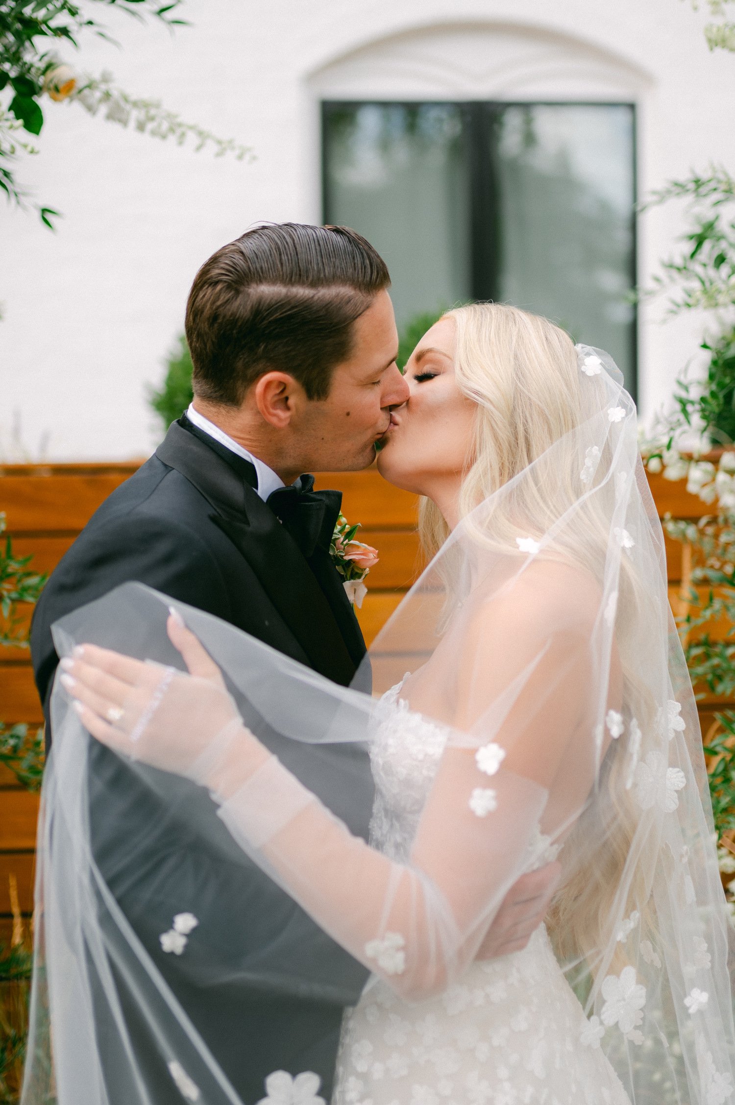 Elm Estate Wedding photos, photo of the bride and groom kissing , and a close up of the bride's wedding veil with intricate floral details