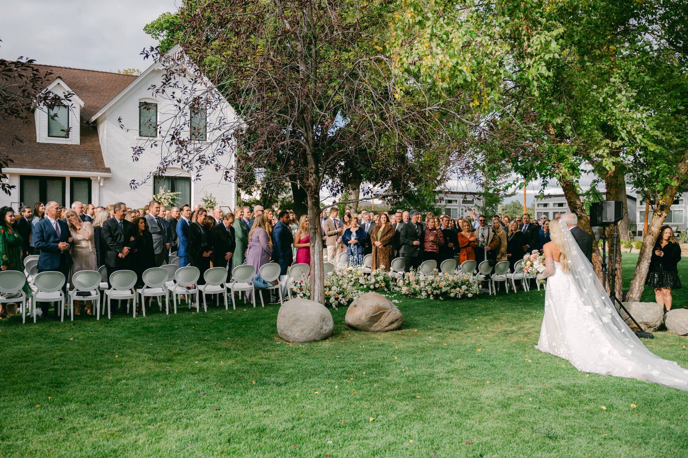 Elm Estate Wedding photos, photo of the bride walking down the aisle in their outdoor garden wedding