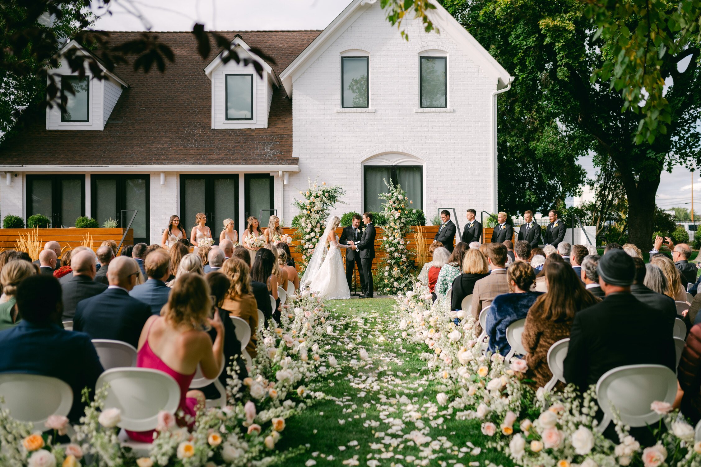 Elm Estate Wedding photos, photo of the bride and groom and guests during the outdoor garden ceremony