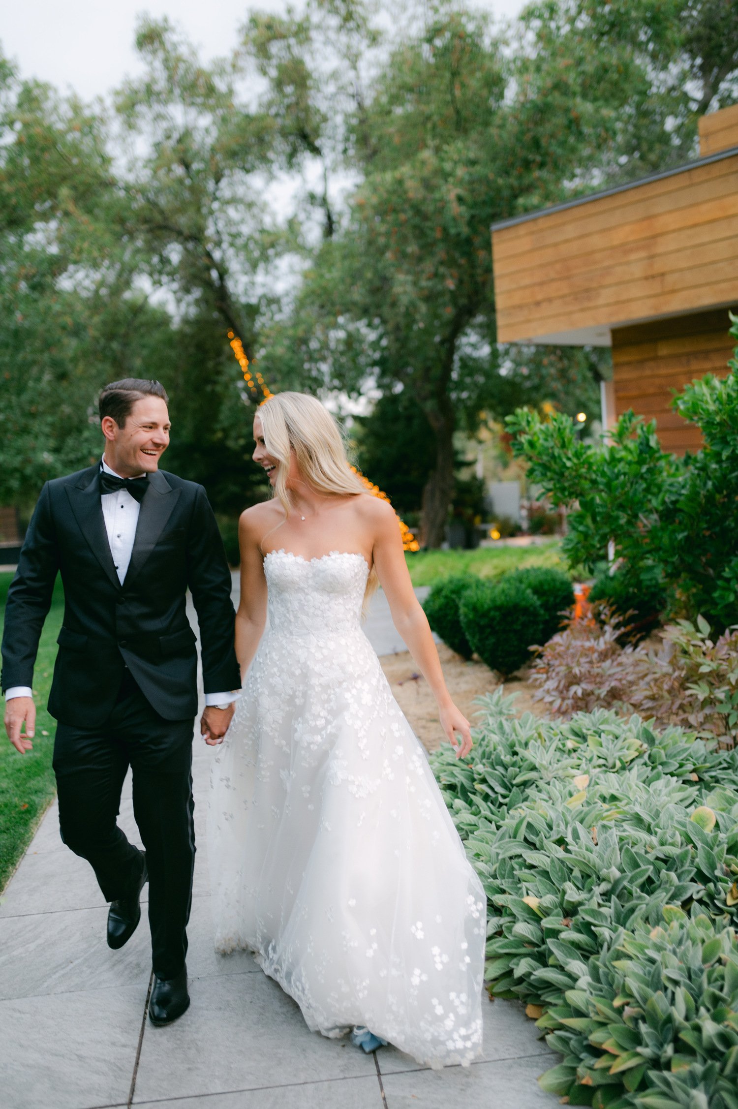 Elm Estate Wedding photos, photo of the bride and groom walking outdoors holding hands