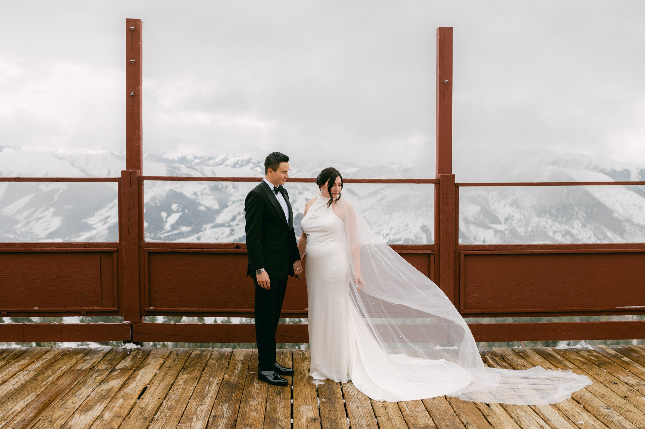 Sun Valley Roundhouse Wedding photo of the bride and groom during their first look while the bride's veil is flying in the wind 