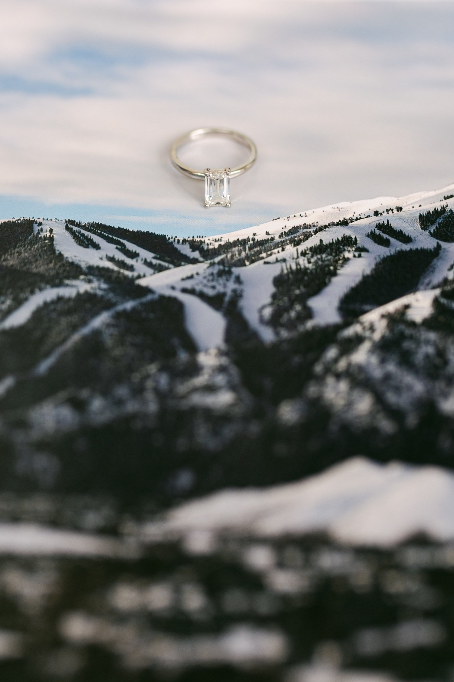 Sun Valley Roundhouse Wedding photos of the bride's ring with the mountains in the invitation