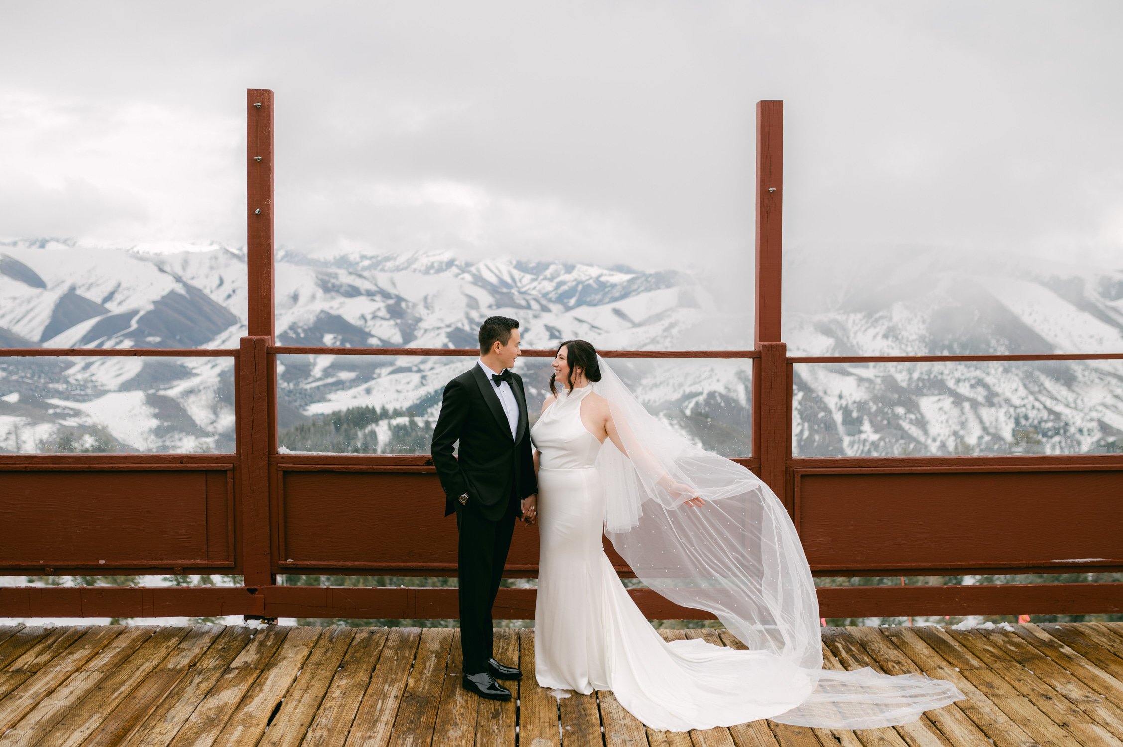 Sun Valley Roundhouse Wedding photos of the bride and groom during their first look with the snowy mountains in the background