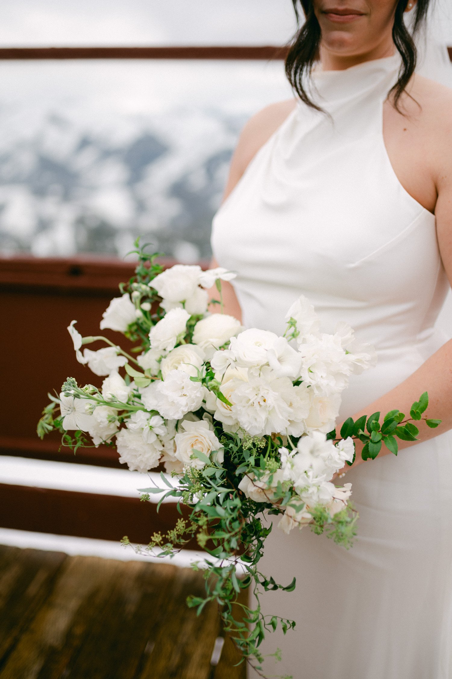 Sun Valley Roundhouse Wedding photos of the bride's wedding bouquet with white flowers and greenery accent