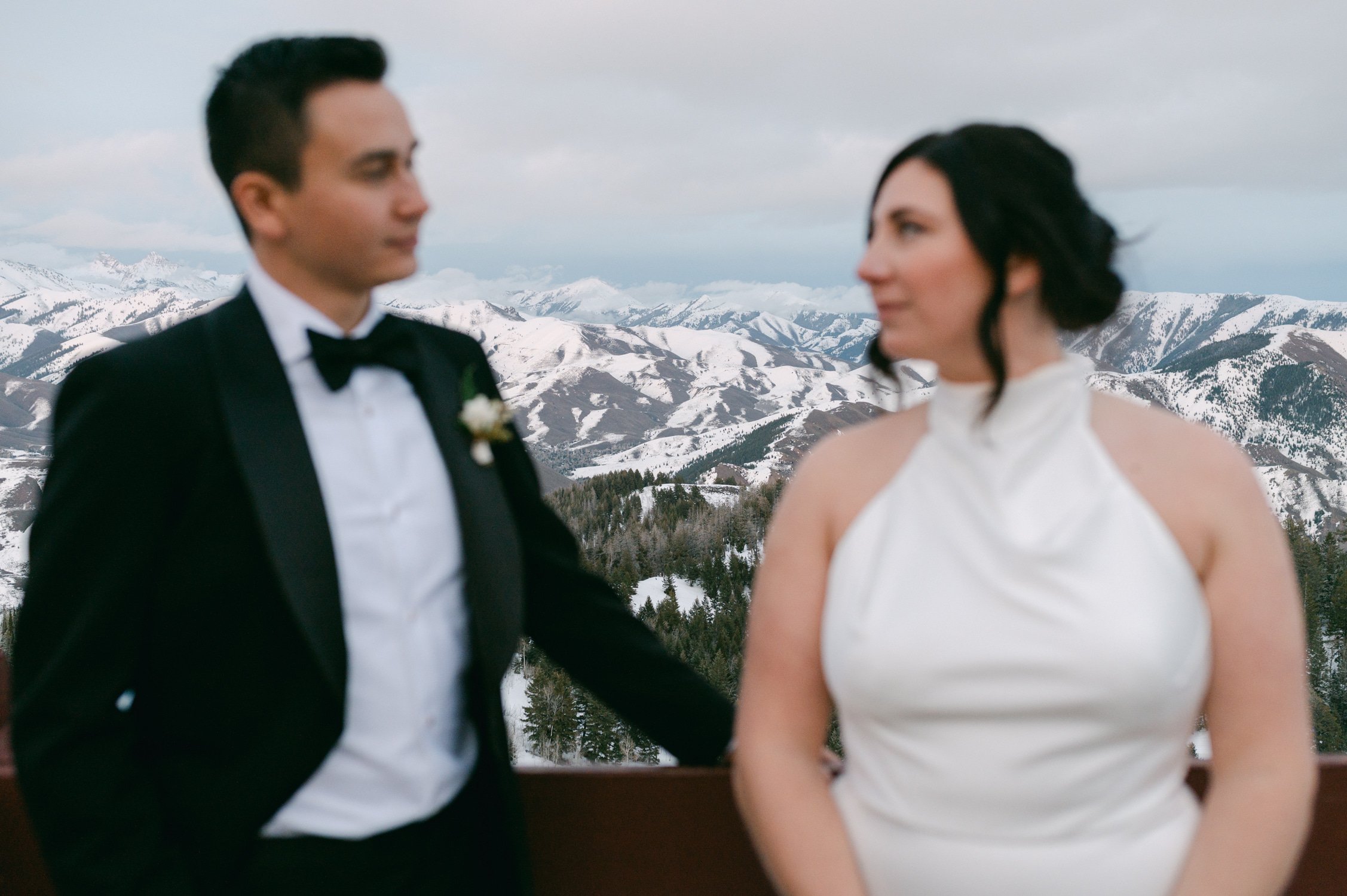 Sun Valley Roundhouse Wedding photo of the newlywed couple looking at each other with mountains in the background