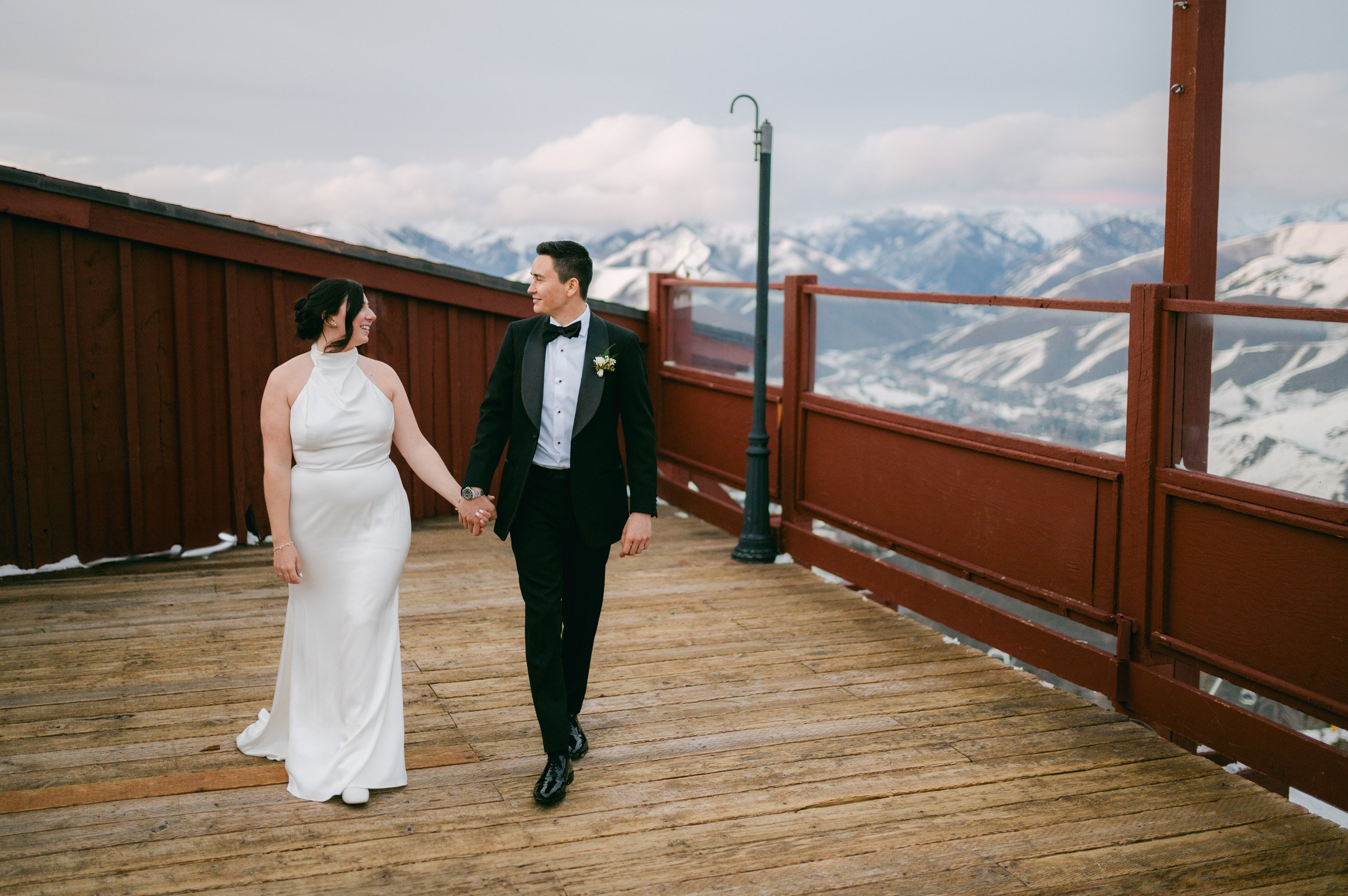 Sun Valley Roundhouse Wedding photo of the newlywed couple holding hands, looking at each other