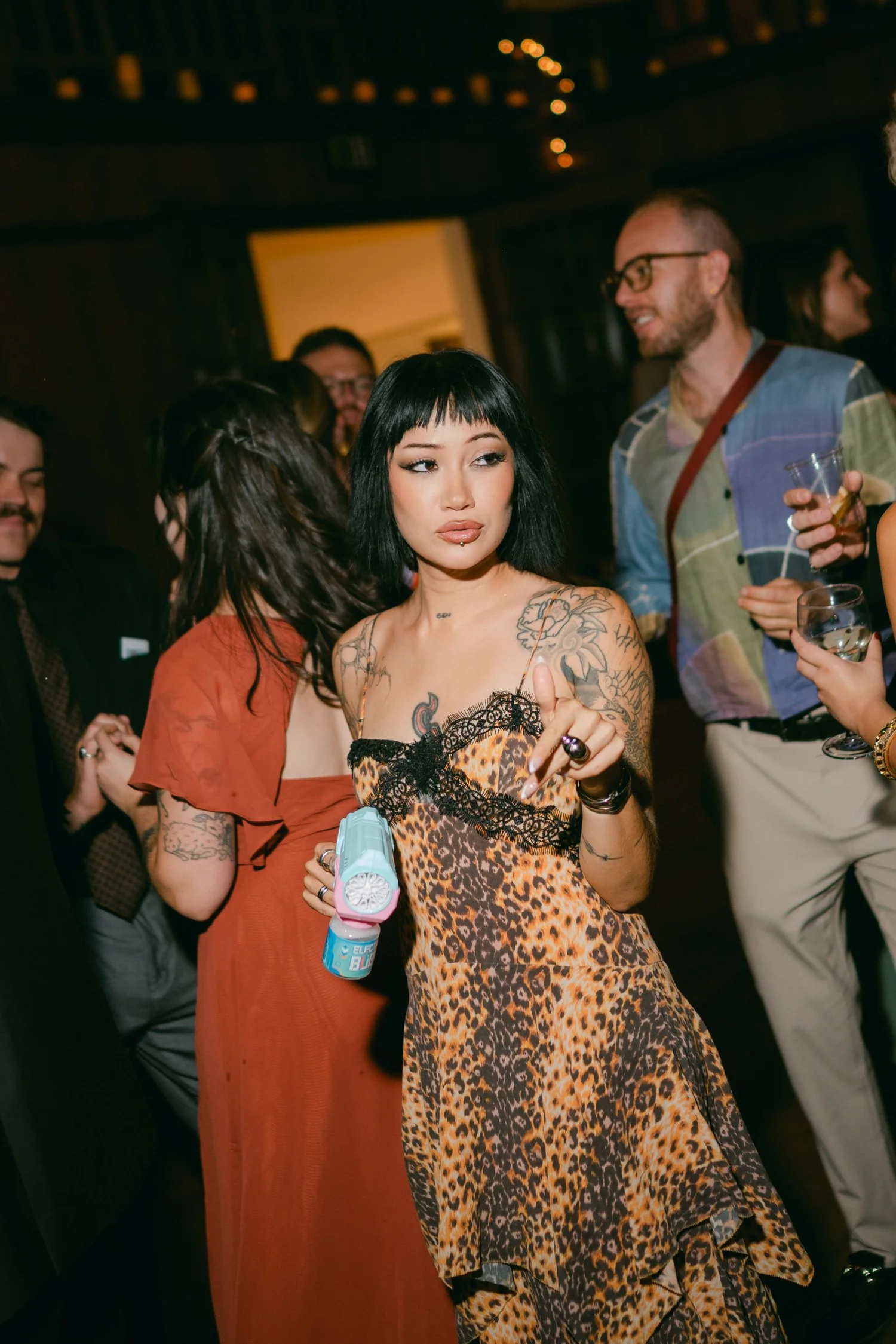 Valhalla wedding photo of a chic guest enjoying the reception
