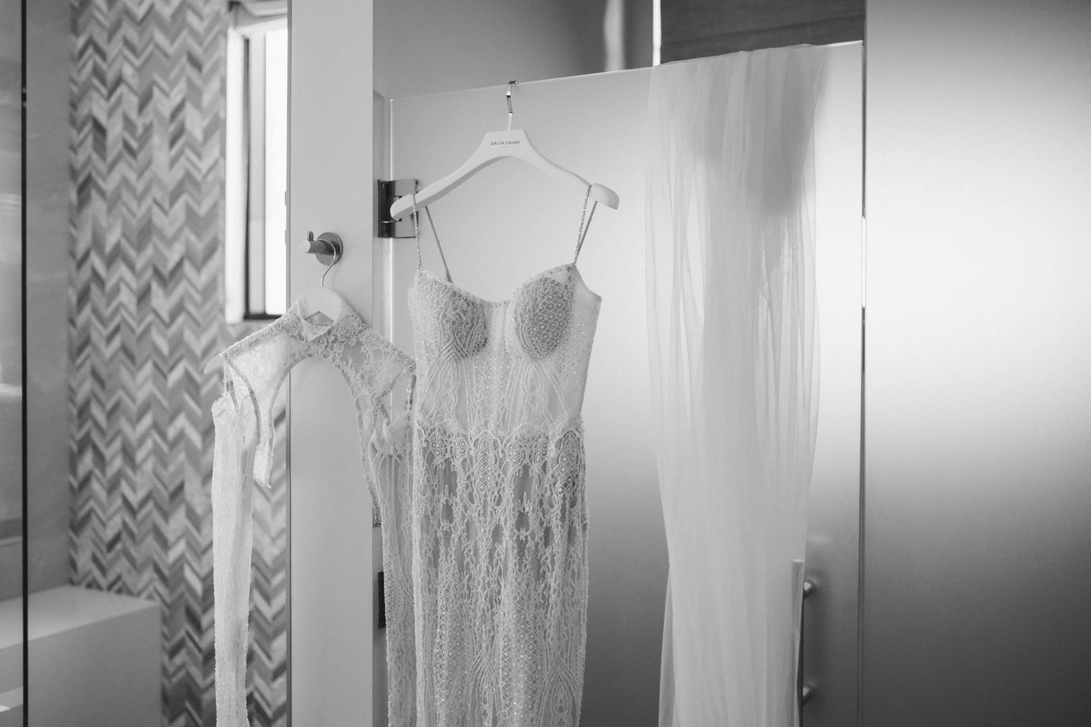 Edgewood Lake Tahoe wedding, photo of the bride’s wedding dress hanging by the door