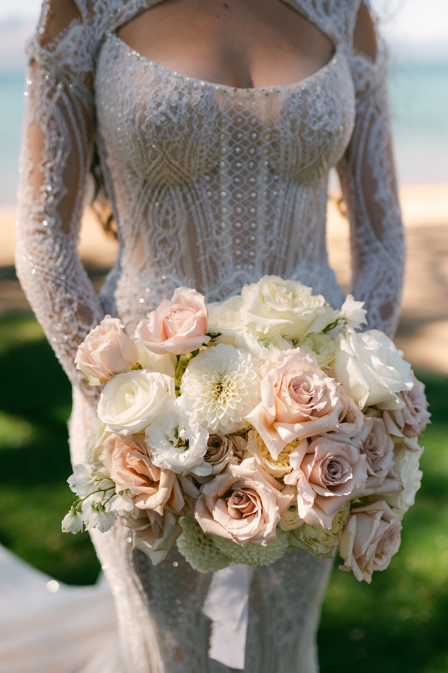 Edgewood Lake Tahoe wedding, photo of the bride in her exquisite gown holding a romantic blush and cream bouquet