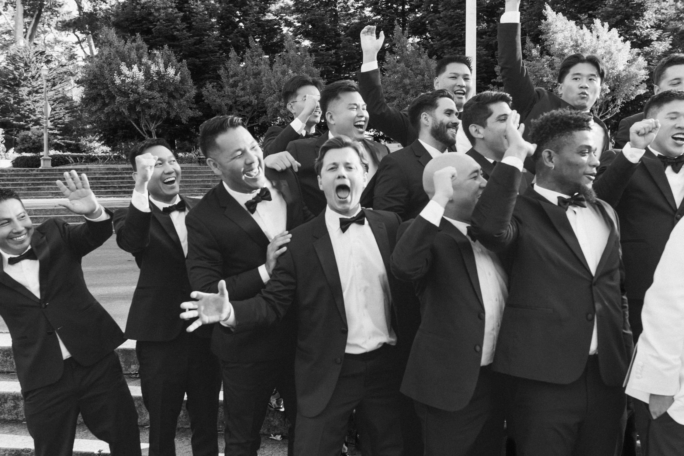 California Academy of Sciences in San Francisco Wedding, photo of the groomsmen cheering for the bride and groom 