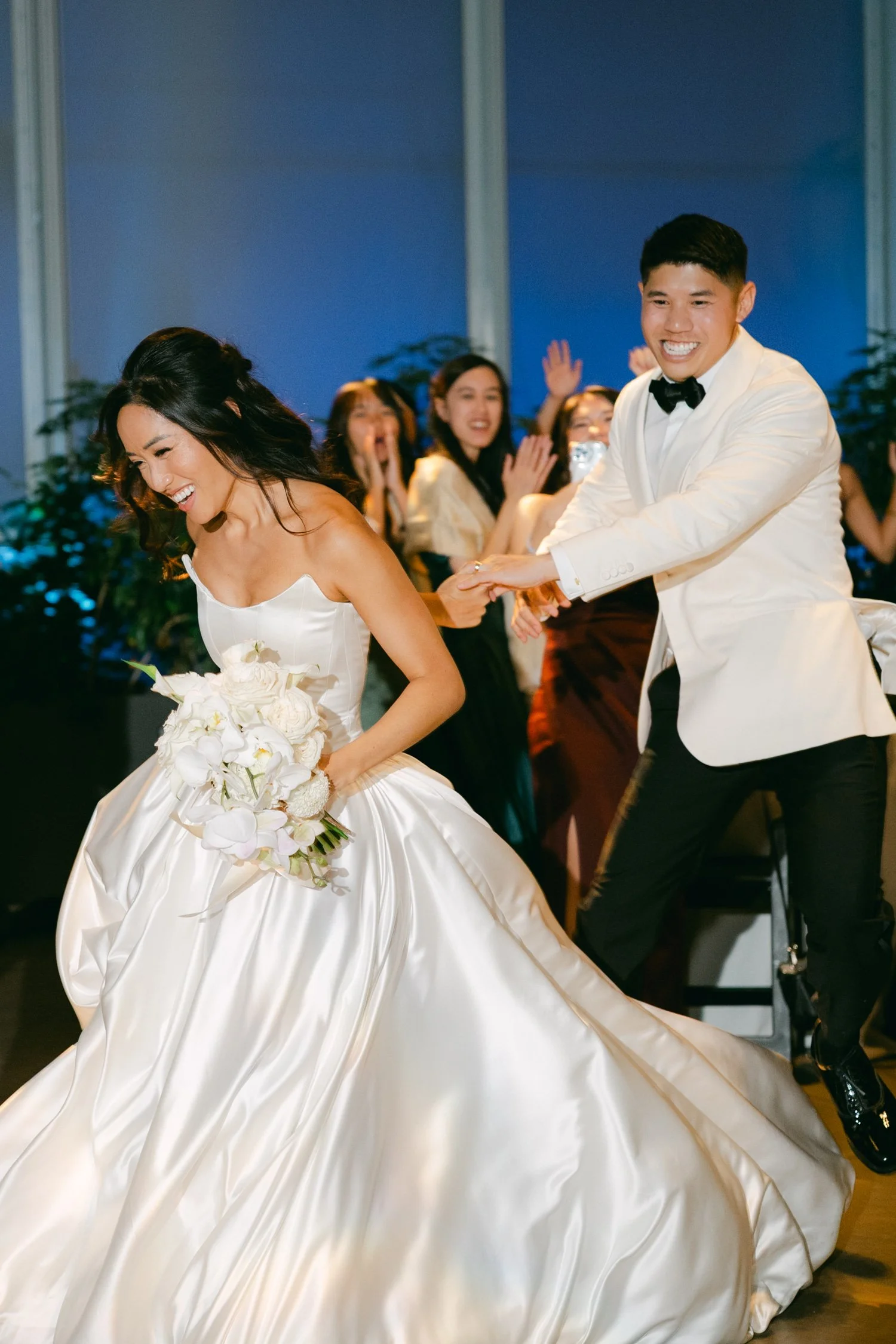 California Academy of Sciences in San Francisco Wedding, photo of the bride and groom entering the reception 