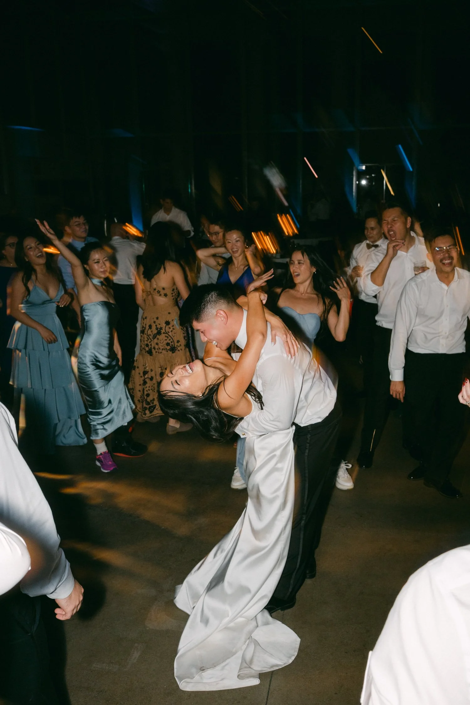 California Academy of Sciences in San Francisco Wedding, photo of the bride and groom celebrating with guests 