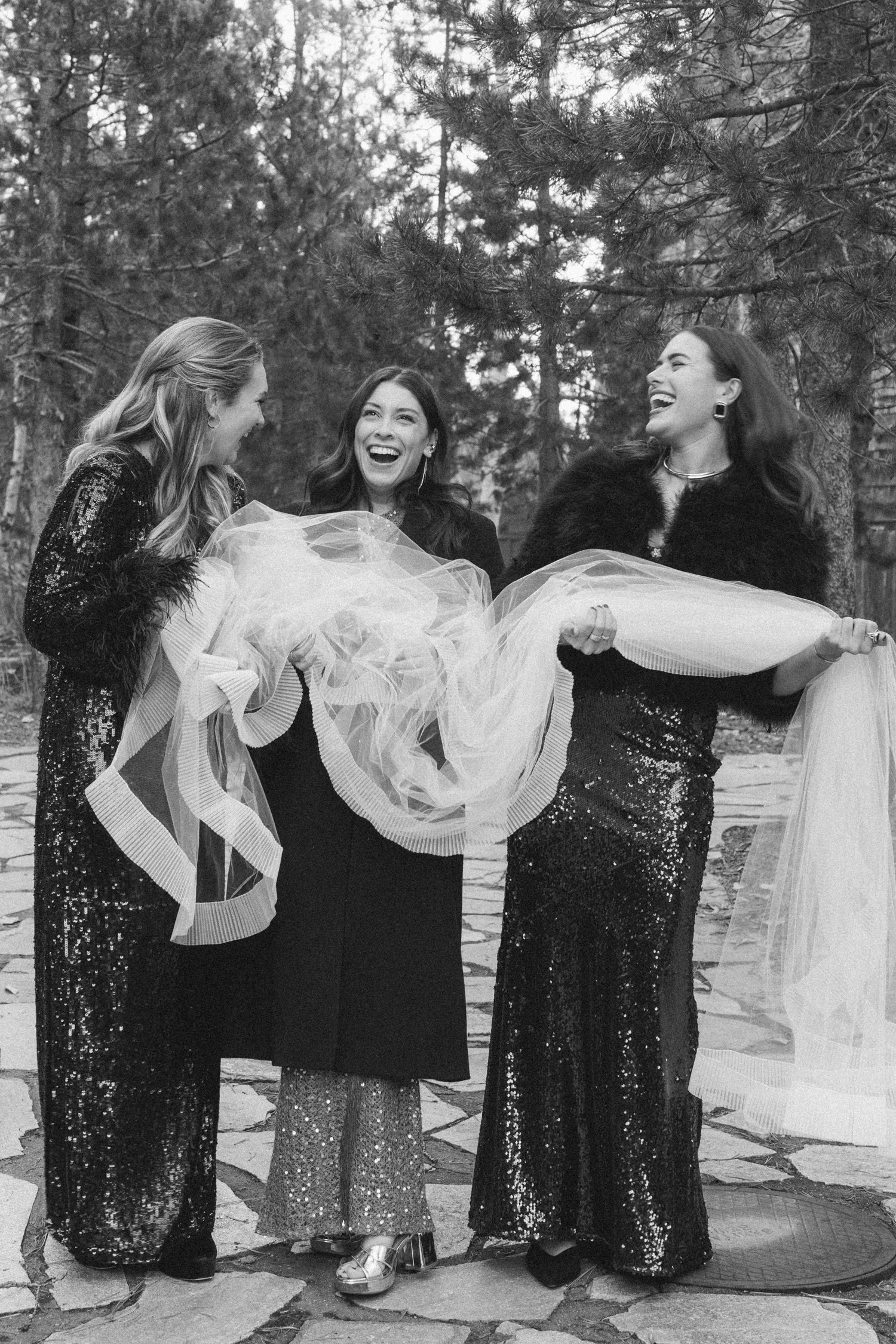 PlumpJack Wedding, photo of the bridesmaids holding the bride’s veil 