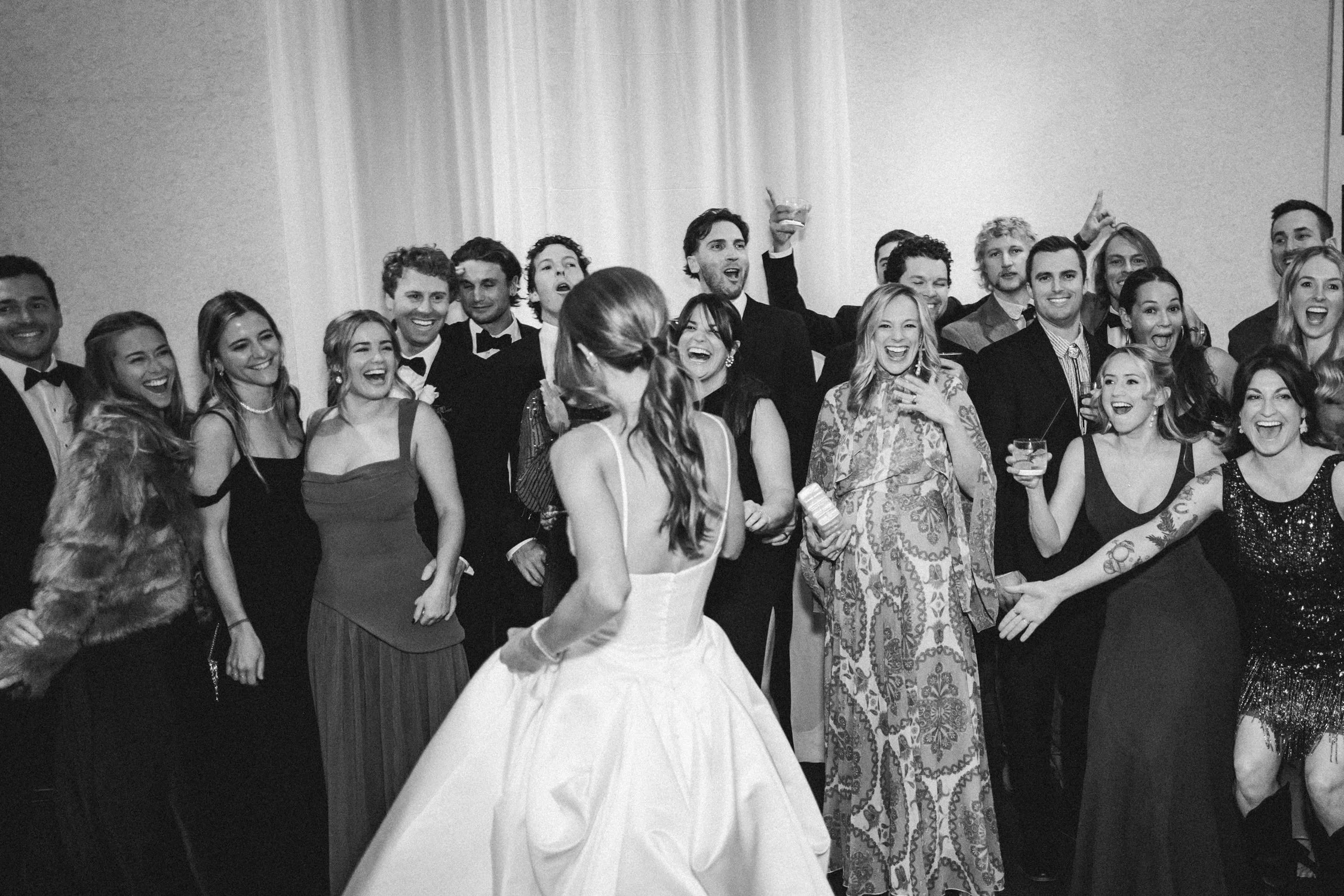 PlumpJack Wedding, photo of wedding guests cheering for the bride note for jhea: I want this photo to be the cover for the blog post please