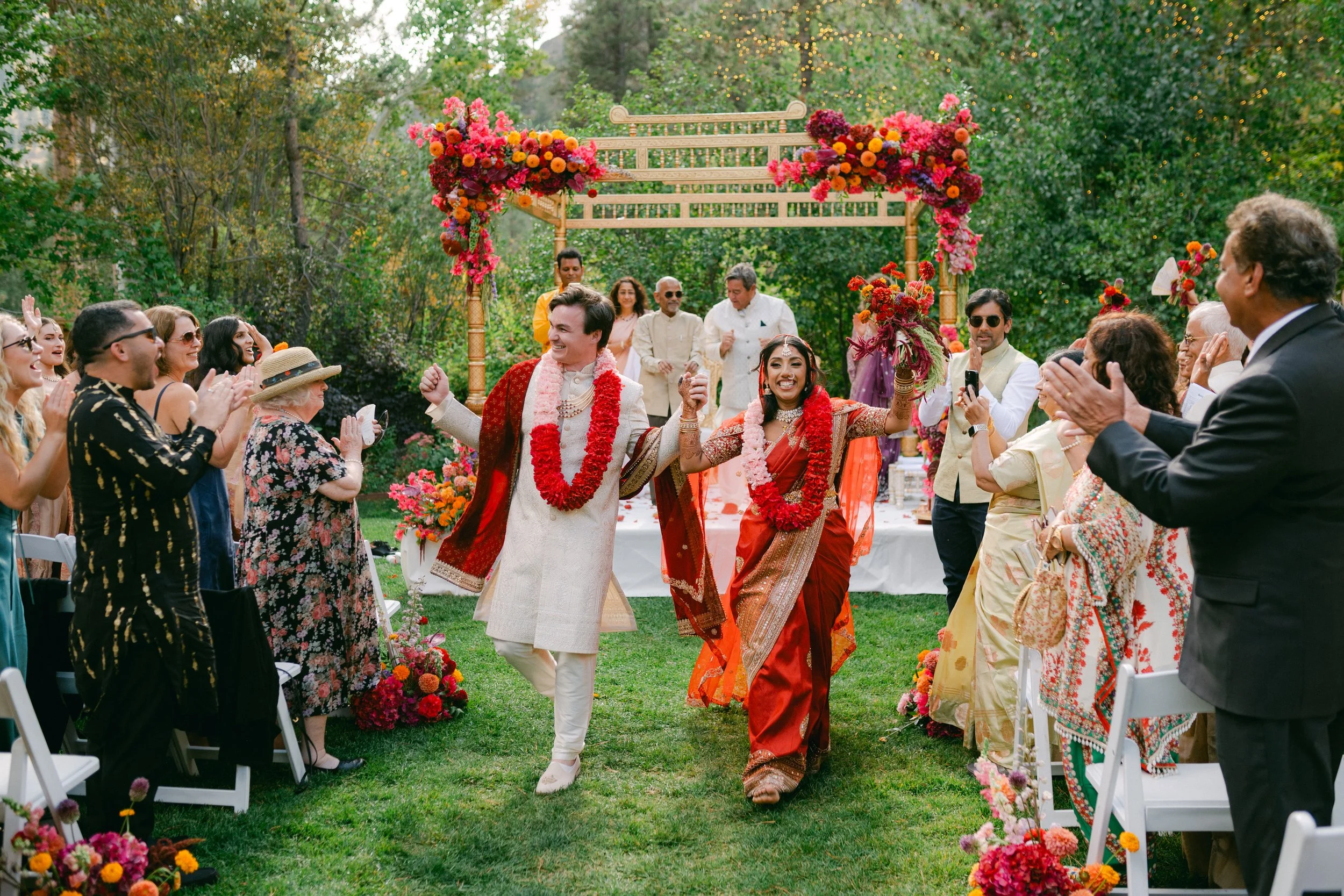 Palisades South Indian wedding photo of the couple joyfully exiting as guests cheer