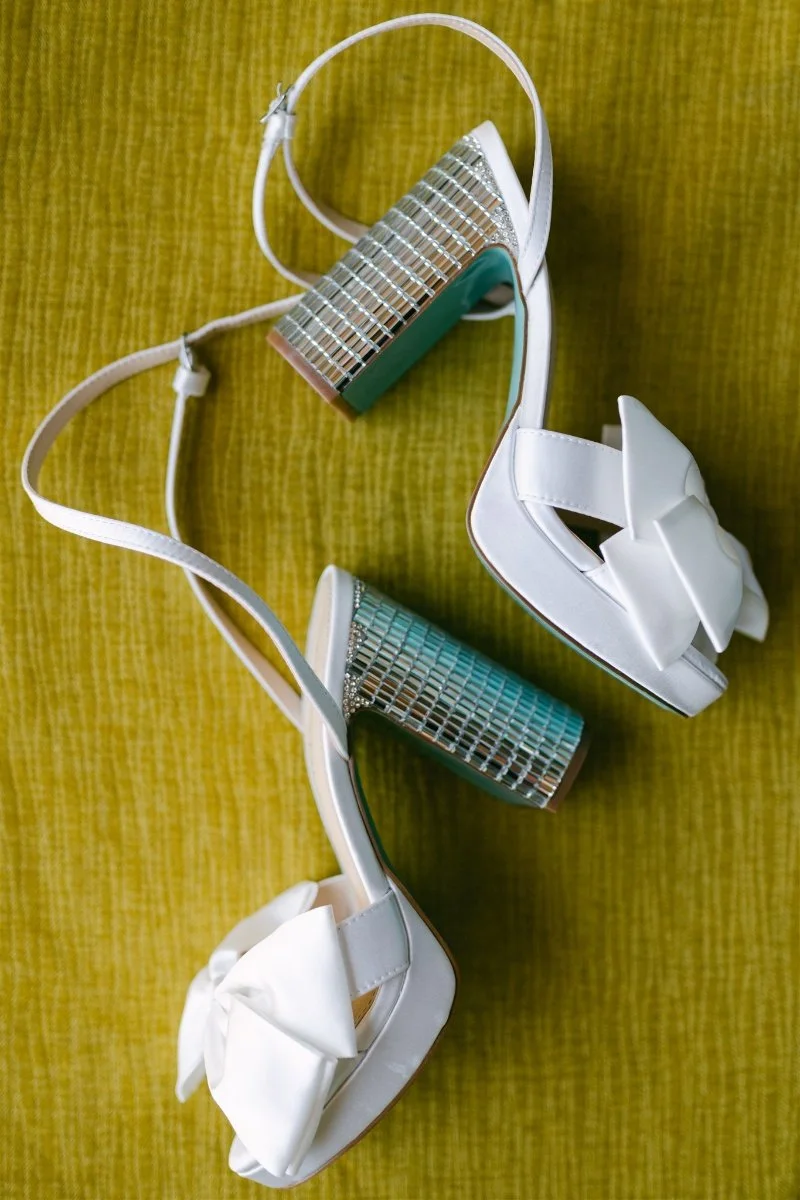 Beach Retreat &amp; Lodge at Tahoe wedding, photo of elegant bridal heels featuring a statement bow and sparkling details