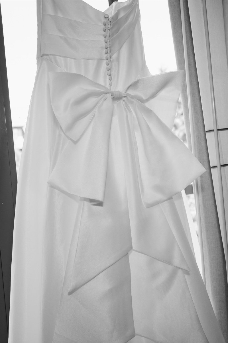 Beach Retreat &amp; Lodge at Tahoe wedding, photo of the wedding dress showcasing oversized bow details at the back