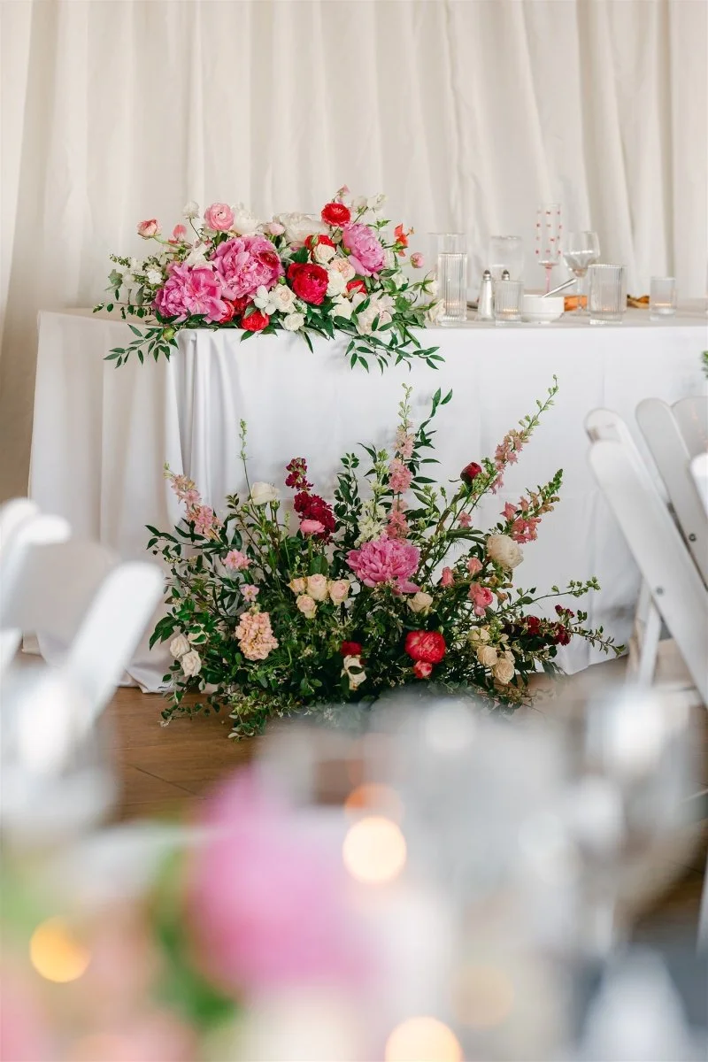 Beach Retreat &amp; Lodge at Tahoe wedding, photo of vibrant pink florals styled on the wedding reception table