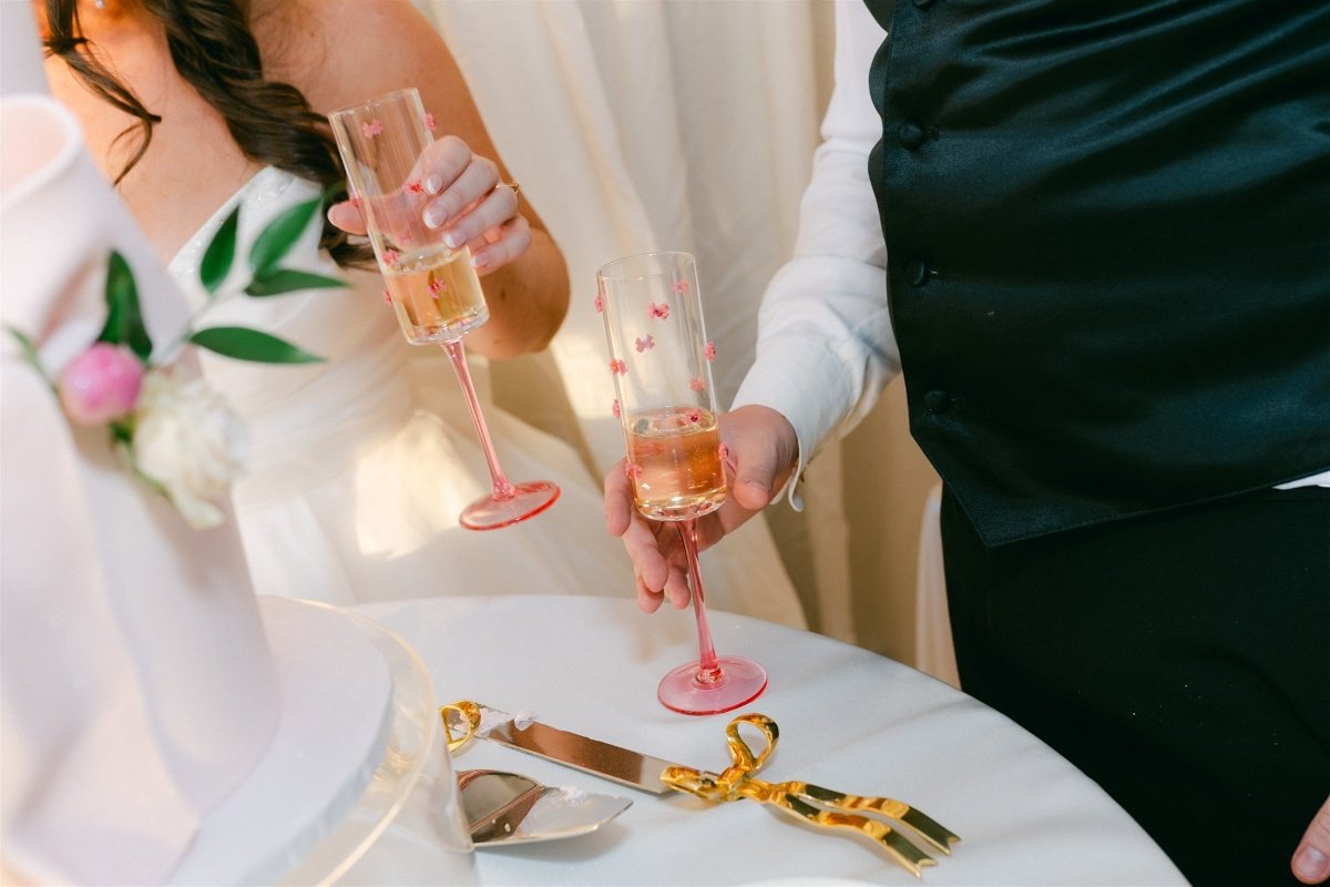 Beach Retreat &amp; Lodge at Tahoe wedding, photo of the bride and groom raising a toast with pink champagne glasses