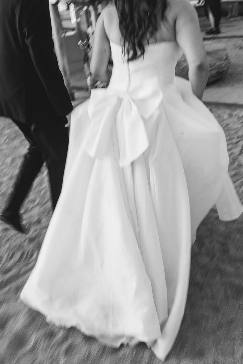 Beach Retreat &amp; Lodge at Tahoe wedding, photo of the bride and groom walking along the sand