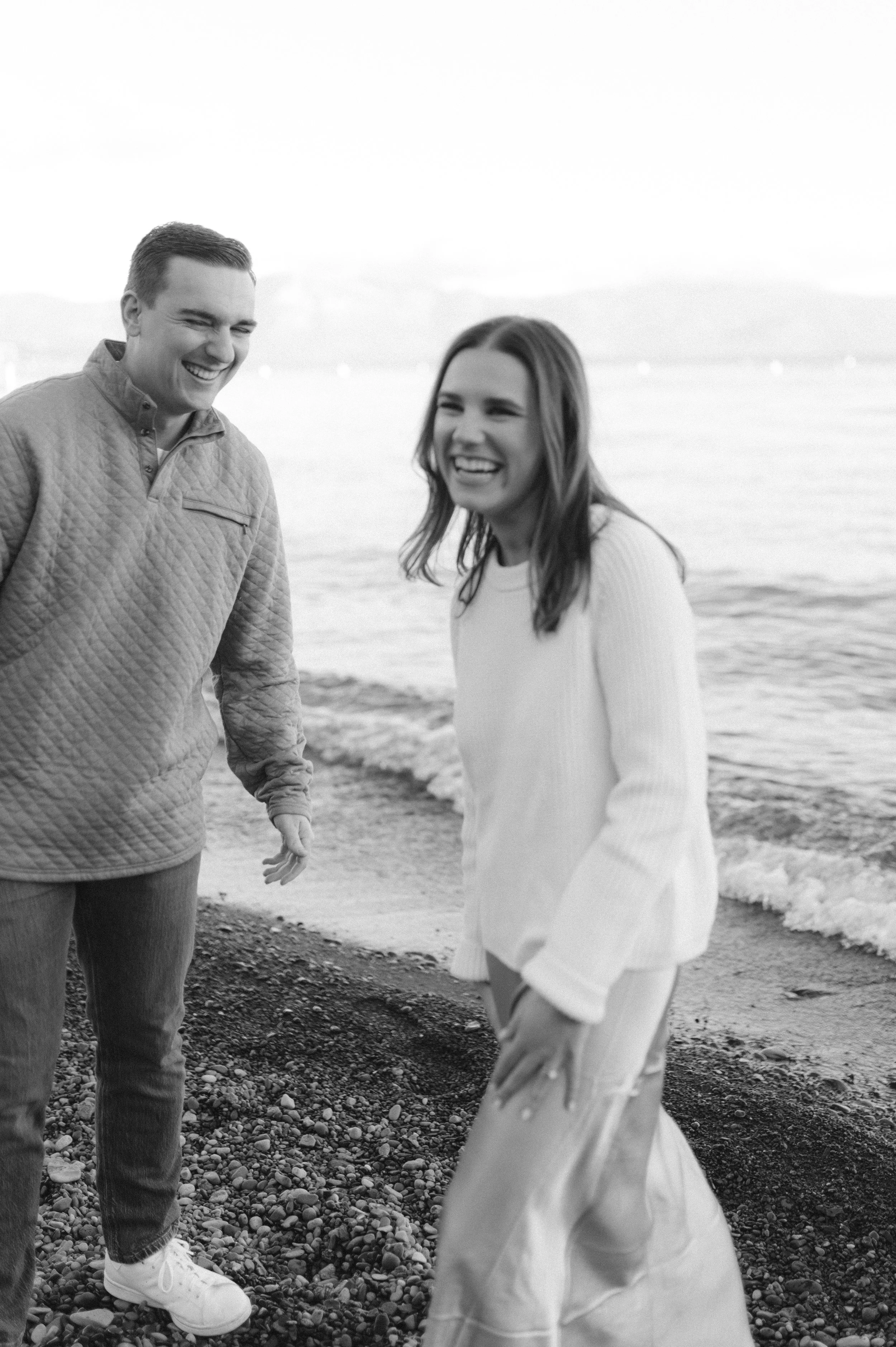 Lake Tahoe Engagement session, photo of the couple enjoying a joyful moment together along the lakes