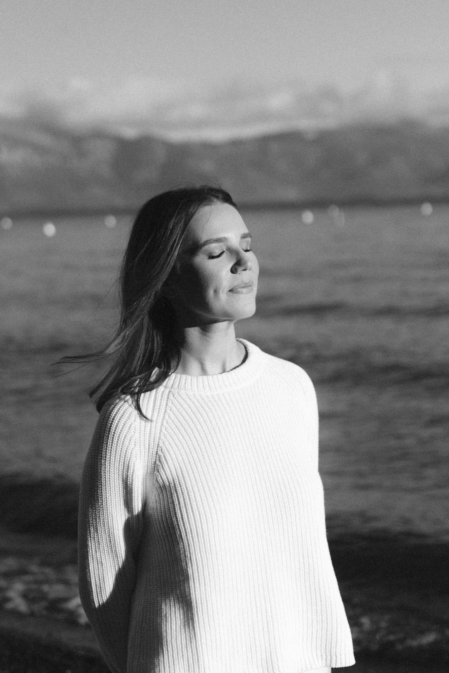 Lake Tahoe Engagement session, photo of the bride wearing a ribbed knit sweater in a peaceful lakeside setting