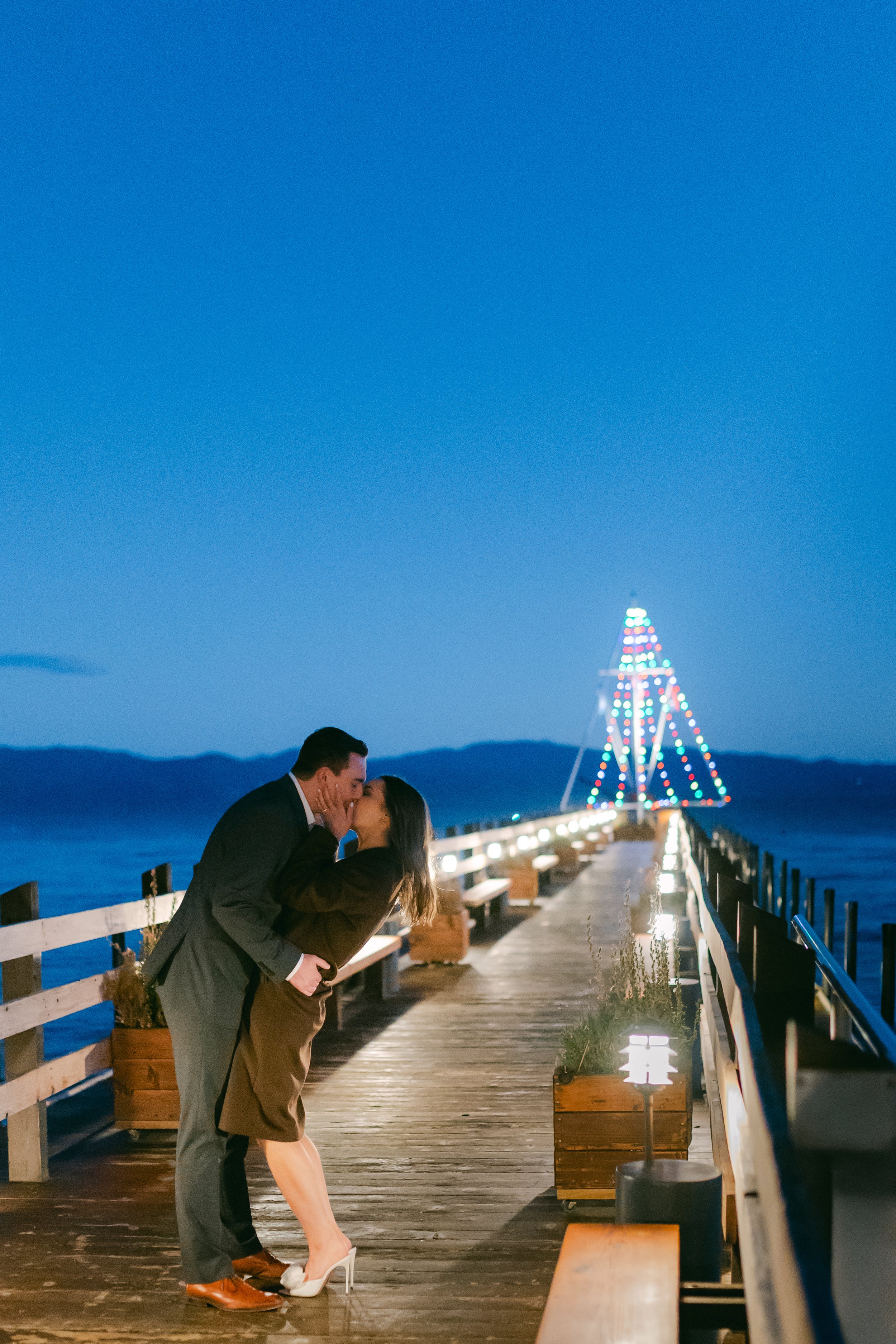 Lake Tahoe Engagement session, photo of a romantic portrait moment on a pier at dusk