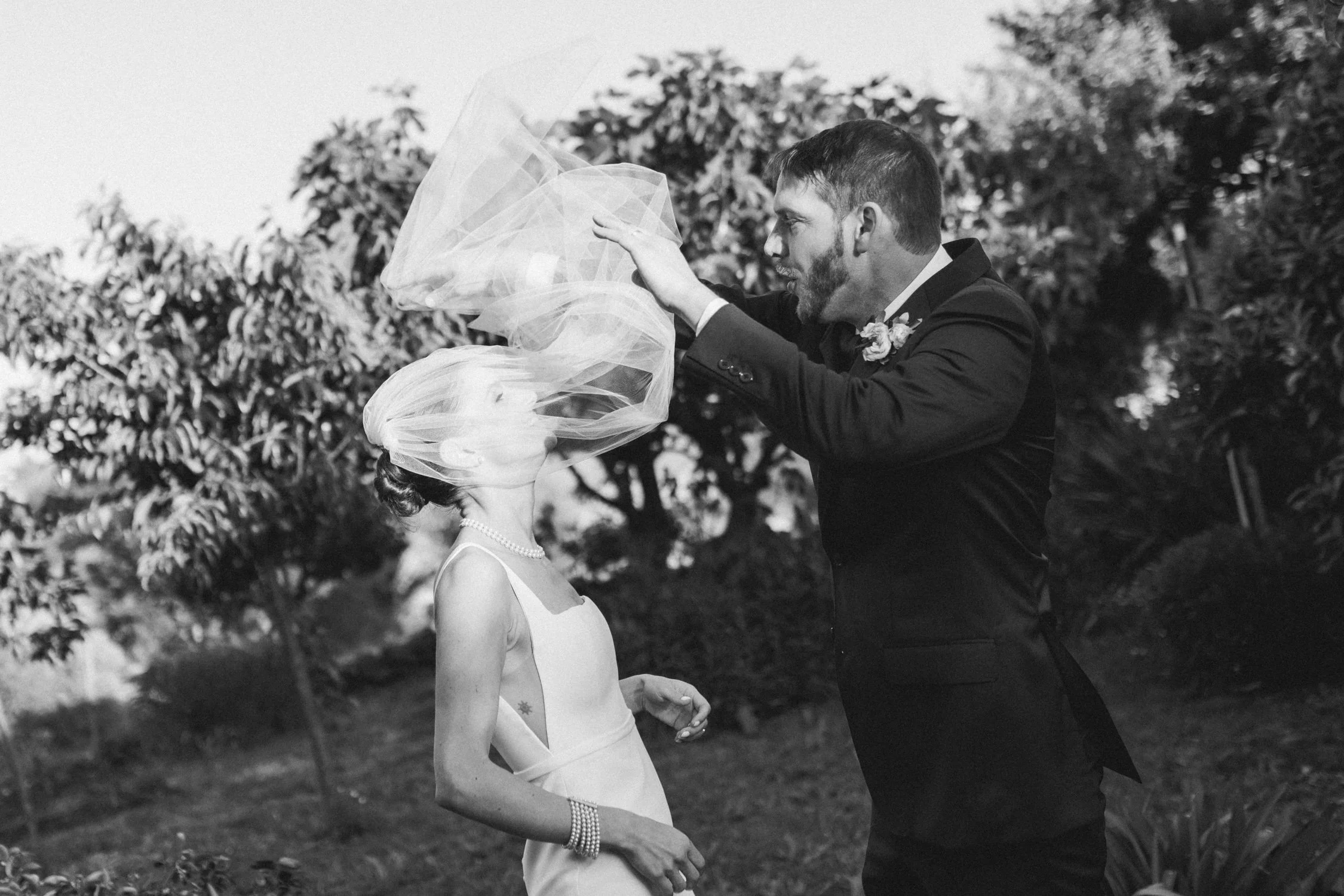 di Rosa wedding photo, photo of the groom fixing the bride's veil