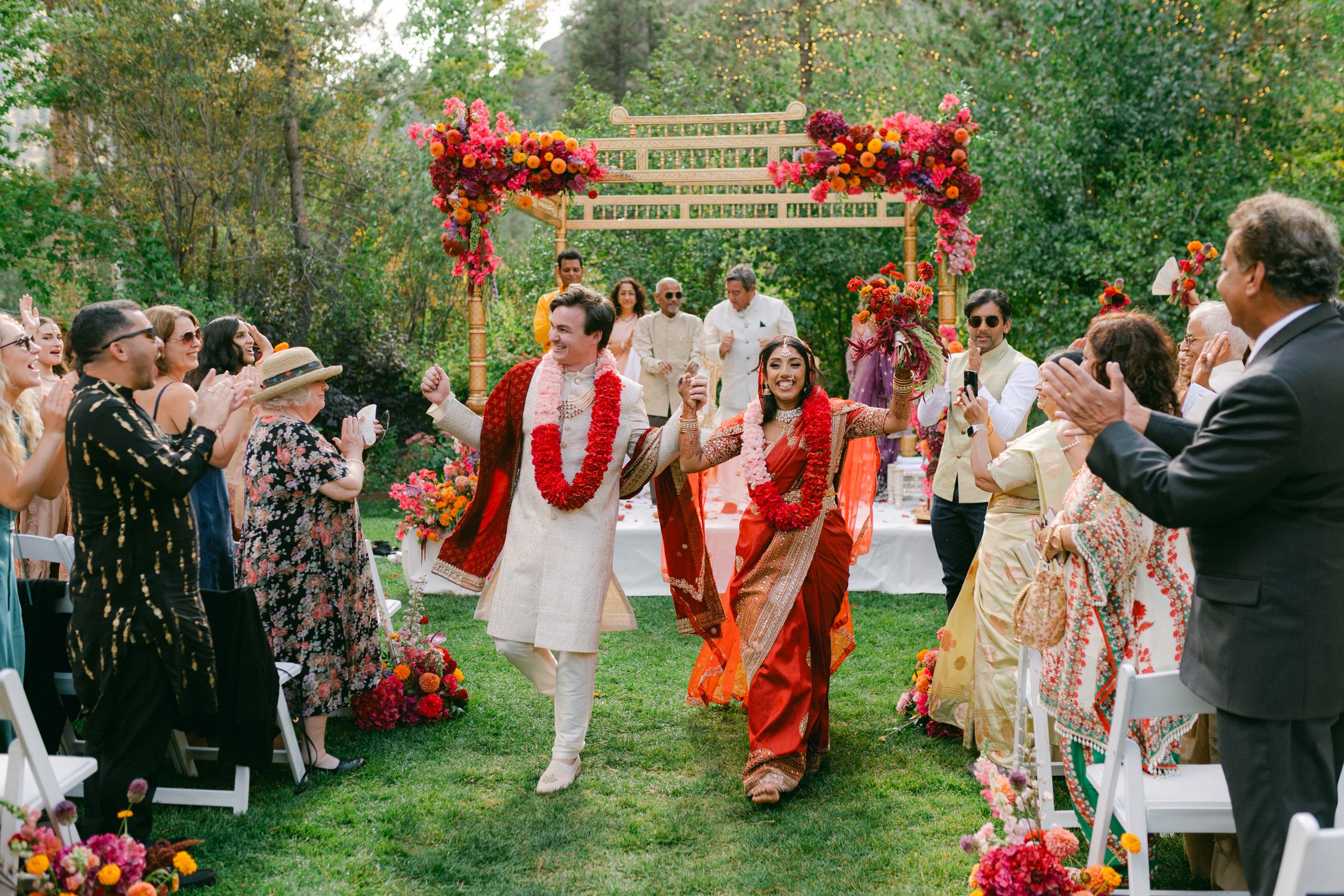 Palisades South Indian wedding photo of the couple joyfully exiting as guests cheer