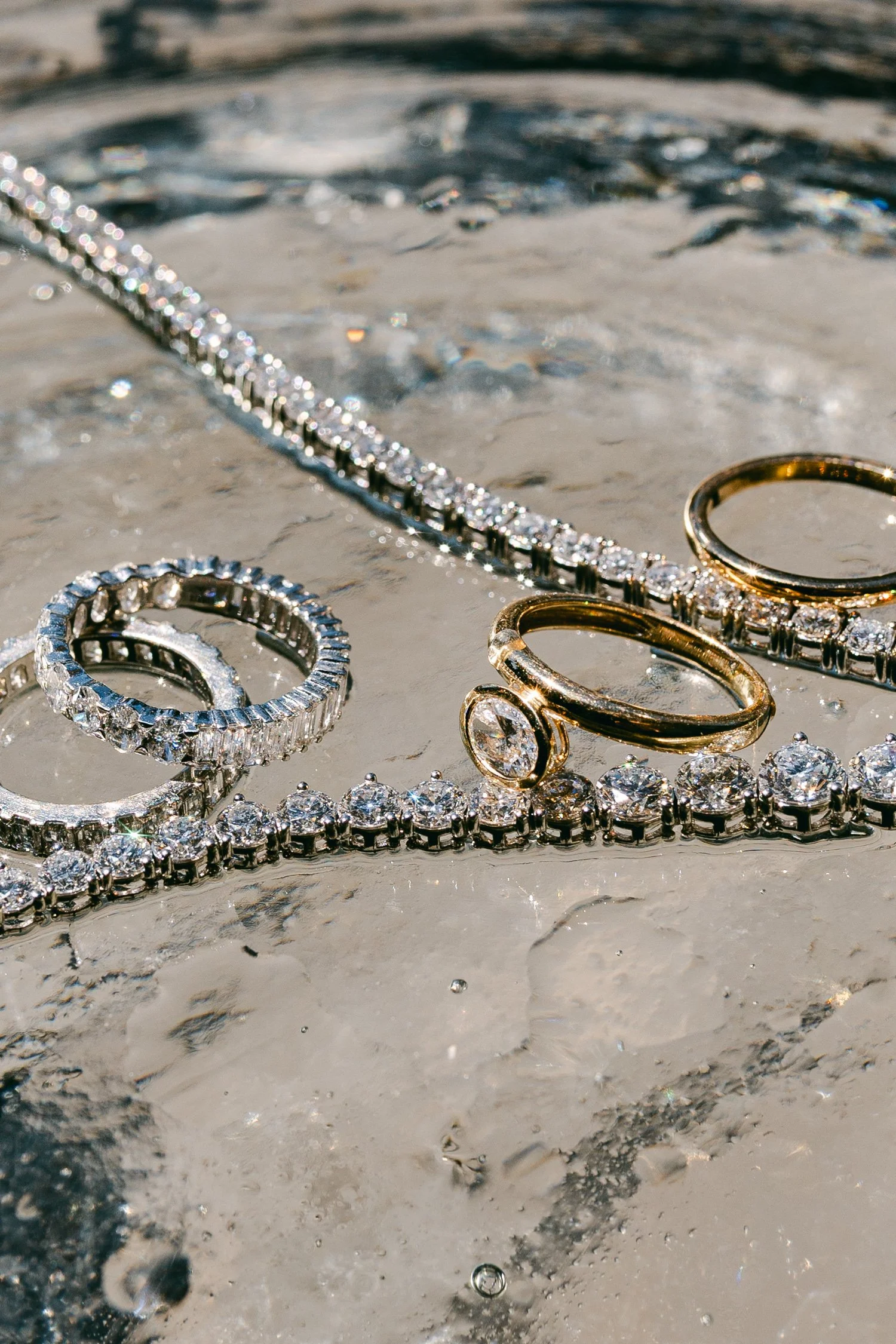 Palisades wedding venue, photo of jewelry set with a diamond engagement ring with a matching diamond eternity band and a diamond tennis necklace. 