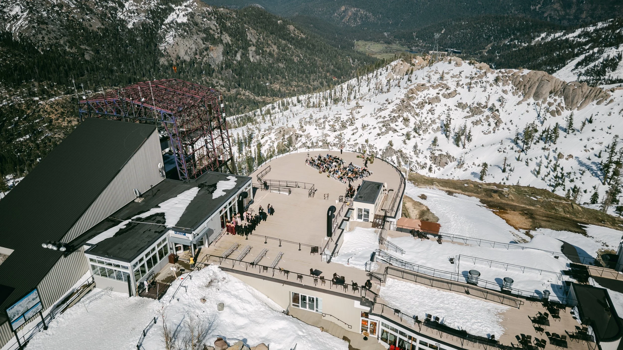 High Camp Ceremony, photo of an outdoor wedding ceremony taking place on the deck of a mountain lodge at the Palisades Tahoe