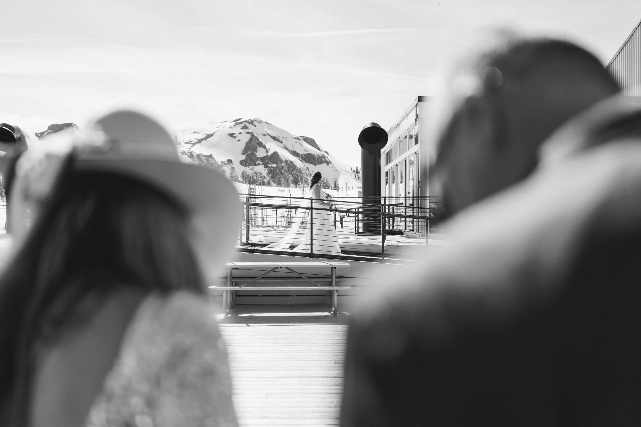 High Camp Ceremony, photo of the bride in a long gown with snowy mountains in the background 