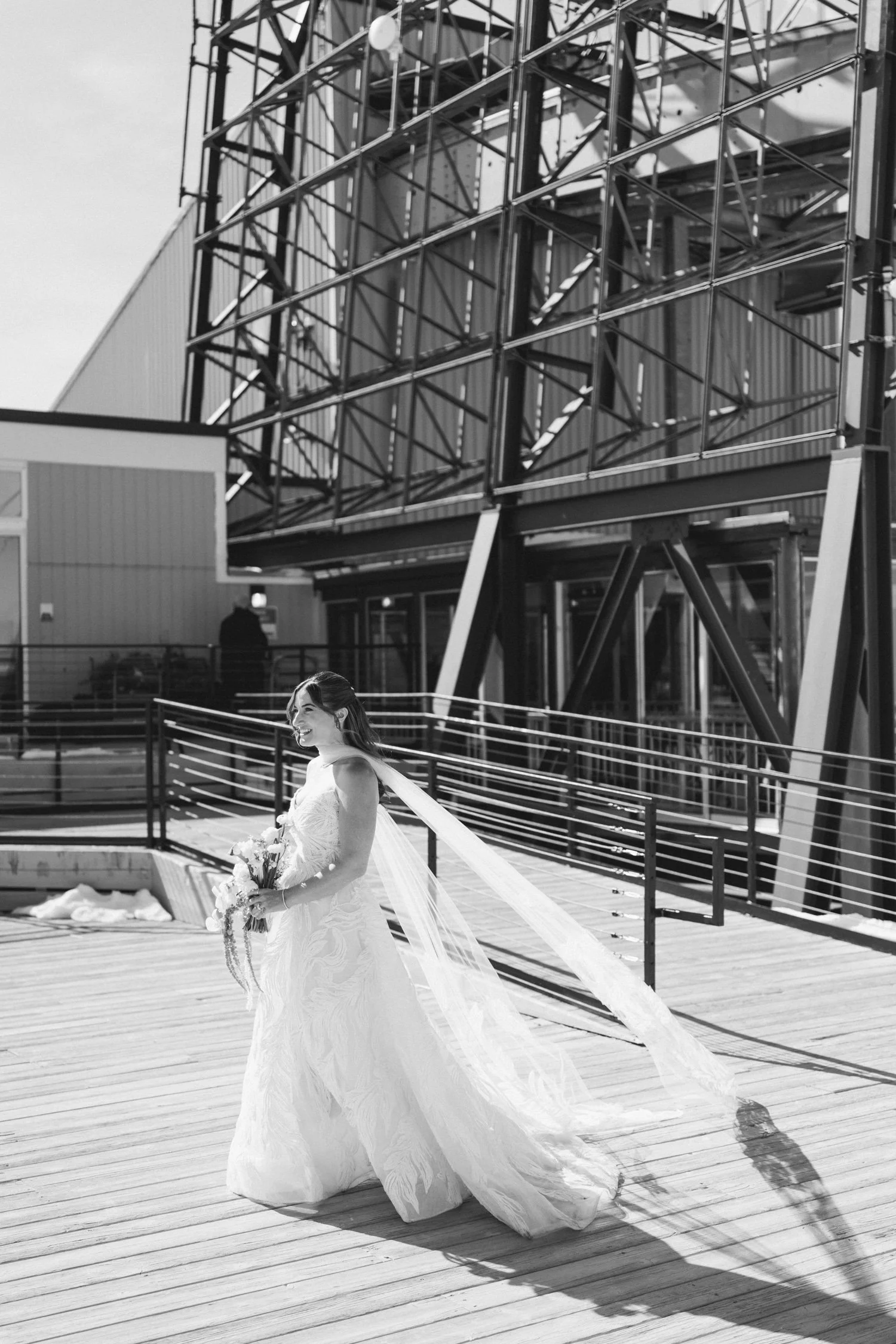 High Camp Ceremony, photo of the bride in a long, flowing veil on her wedding day walking down the aisle