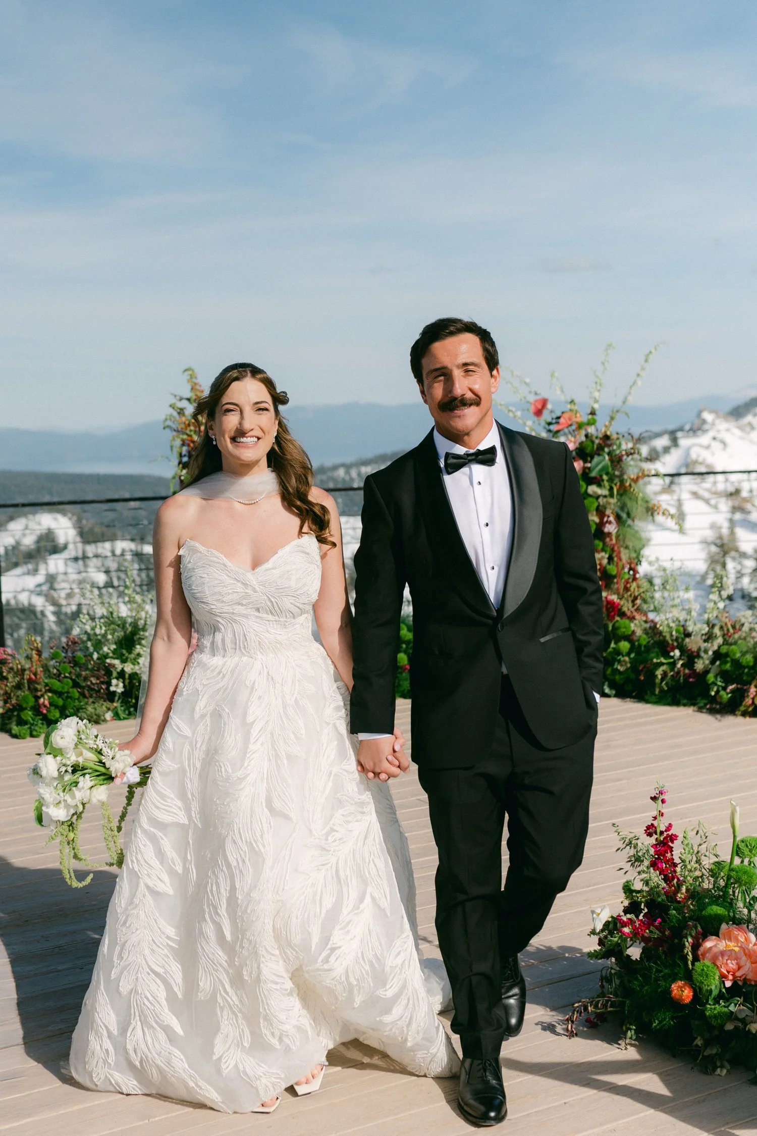 High Camp Ceremony, photo of a couple on their wedding day, set against a scenic backdrop. 