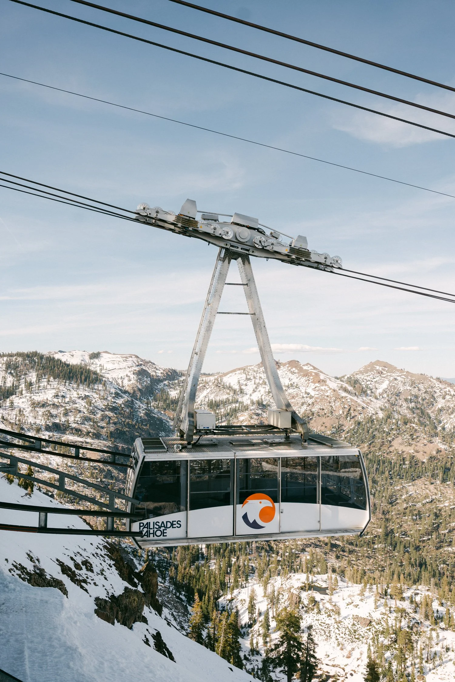 Palisades wedding venue, photo of Palisades Tahoe Aerial Tram ascending the snowy mountains at the Palisades Tahoe ski resort in California. 