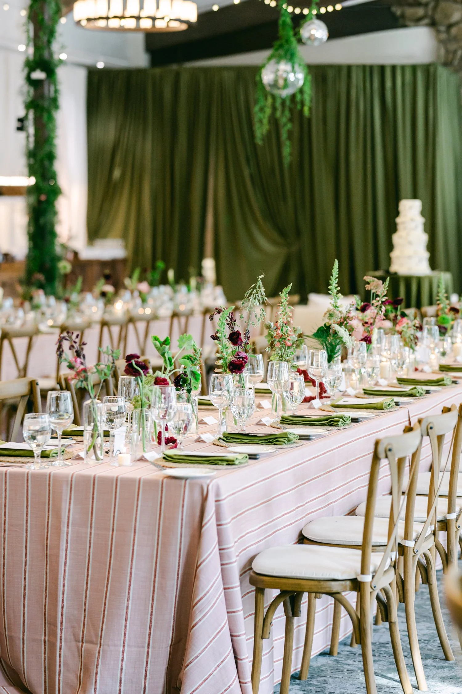 Palisades wedding venue, photo of a modern wedding reception table design featuring vibrant decor and drapery. 
