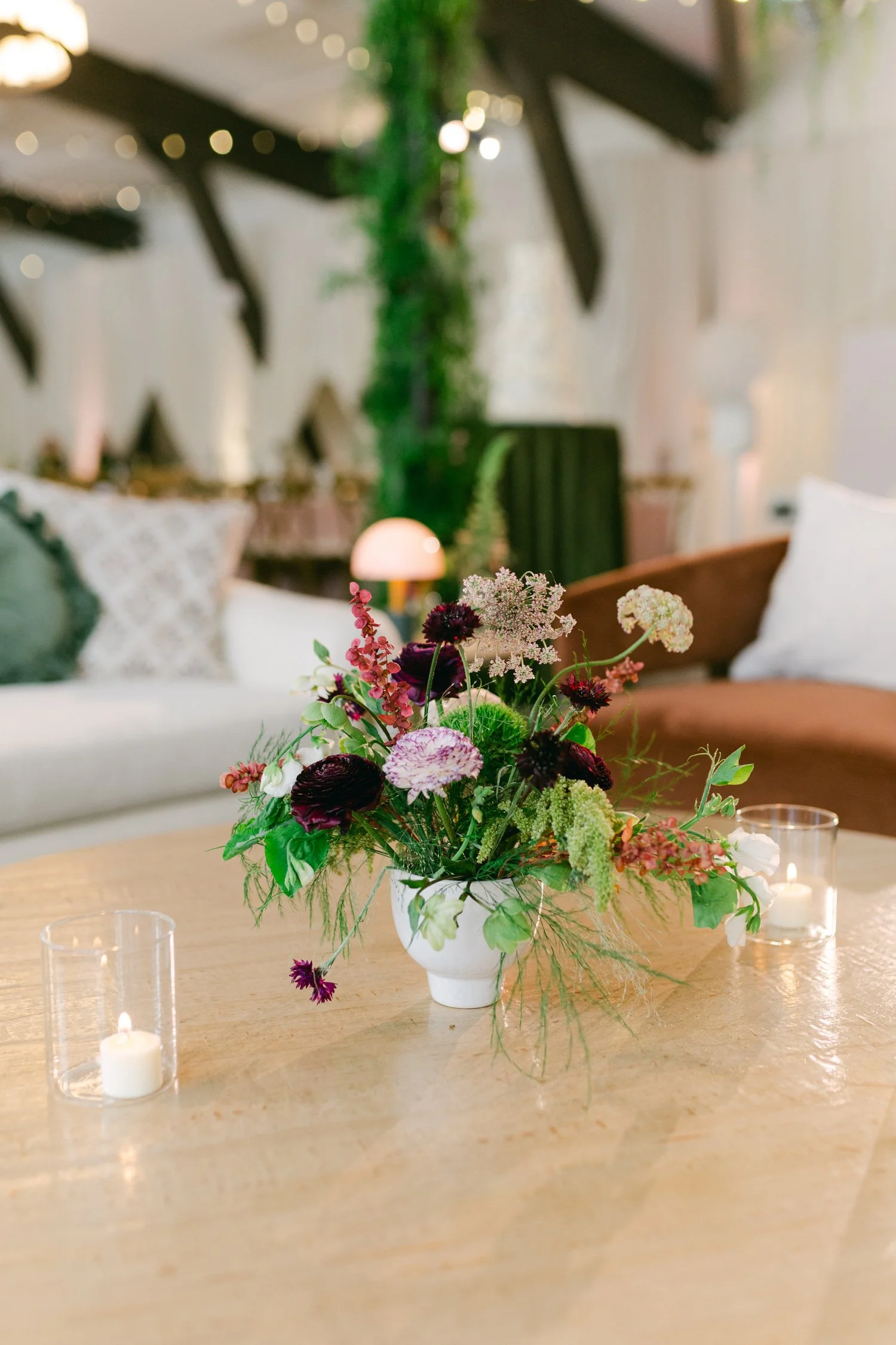 Palisades wedding venue, photo of moody, earthy-toned wedding scene featuring a floral centerpiece on a table.