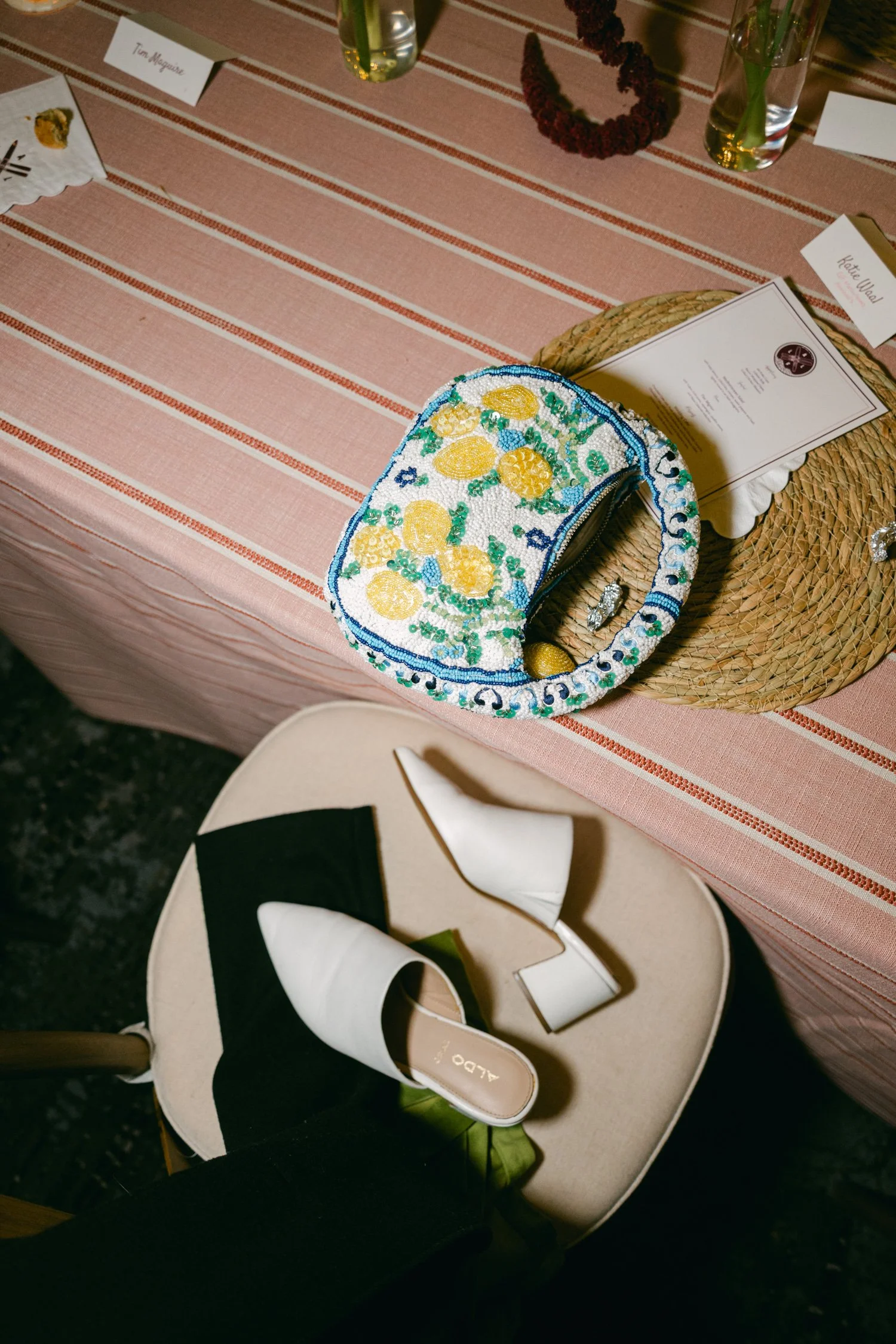 Palisades wedding venue, photo of white white mules and a floral beaded handbag