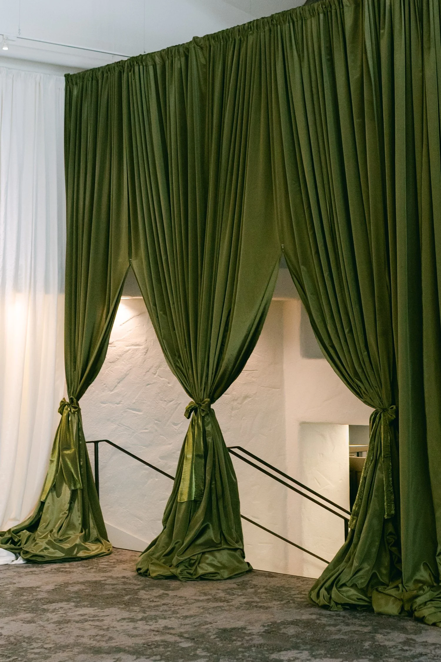 Palisades wedding venue, photo of olive green satin curtains used as event drapery