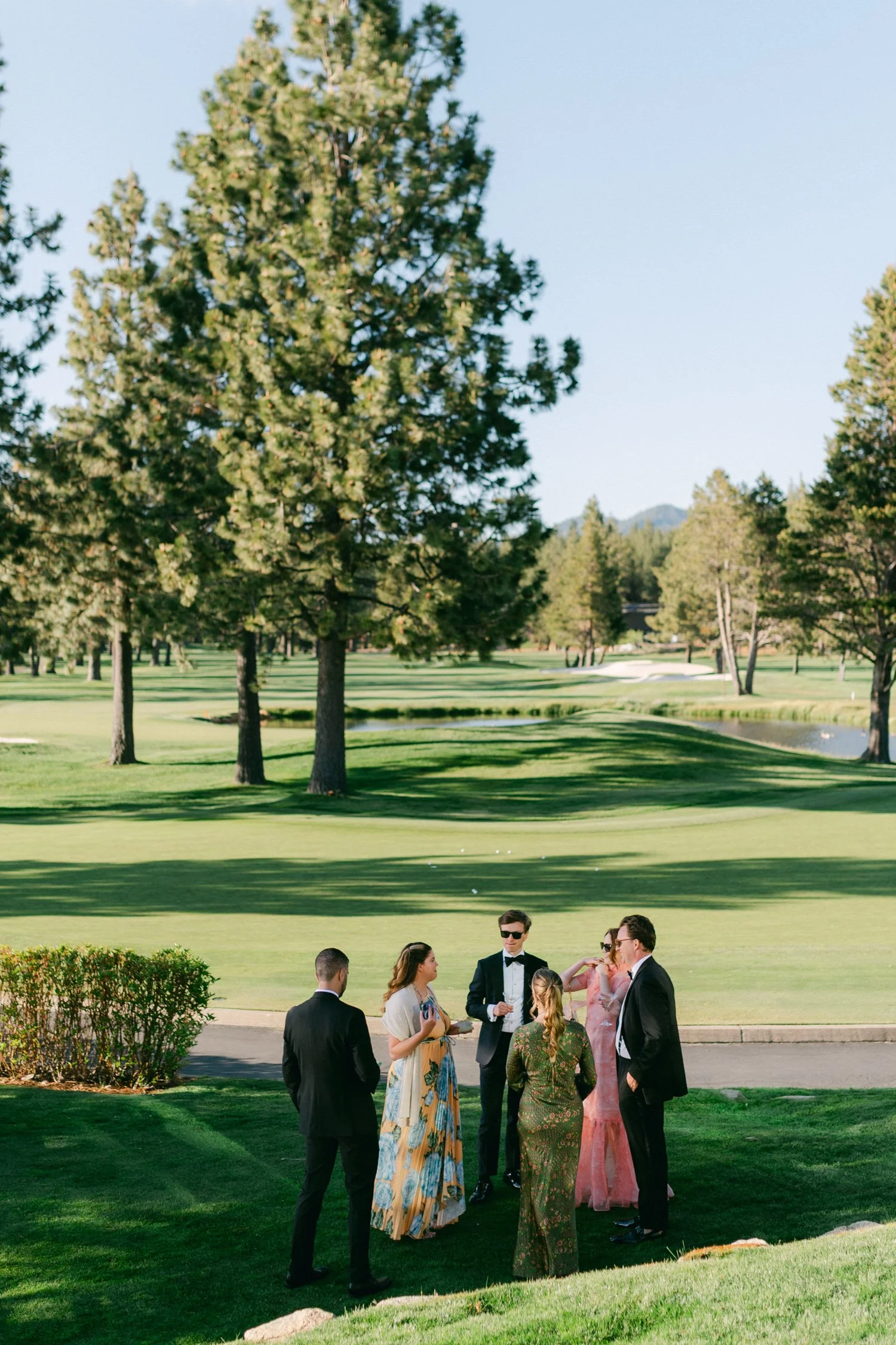 Edgewood maximalist wedding, photo of stylish wedding guests during an outdoor afternoon reception 